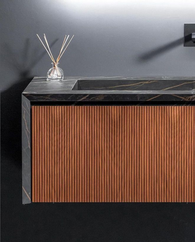 Bespoke black marble sink with fluted wood effect on the front