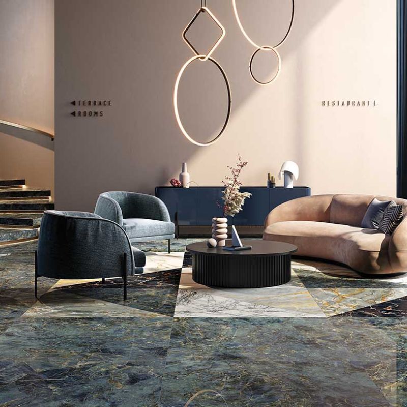 marble effect tile in living space with blue single chairs
