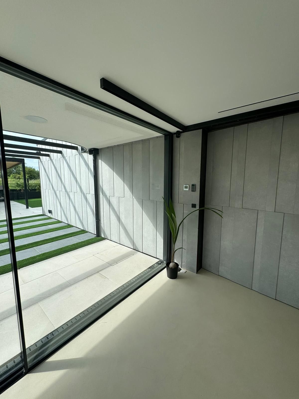 walk way with grey wall tiles and patio floor tiles