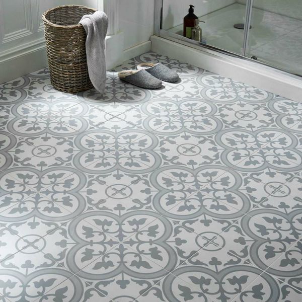 Grey patterned tile with grey slippers in the corner