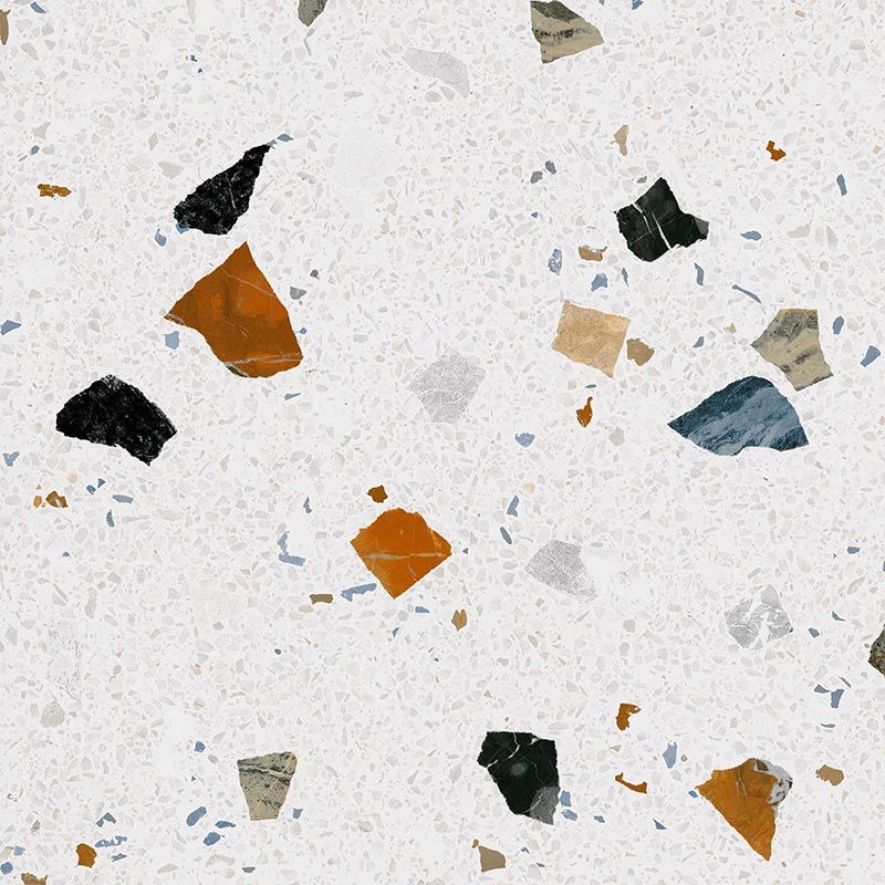Close-up of white terrazzo floor tiles with multicolored stone chips in shades of brown, black, and grey.