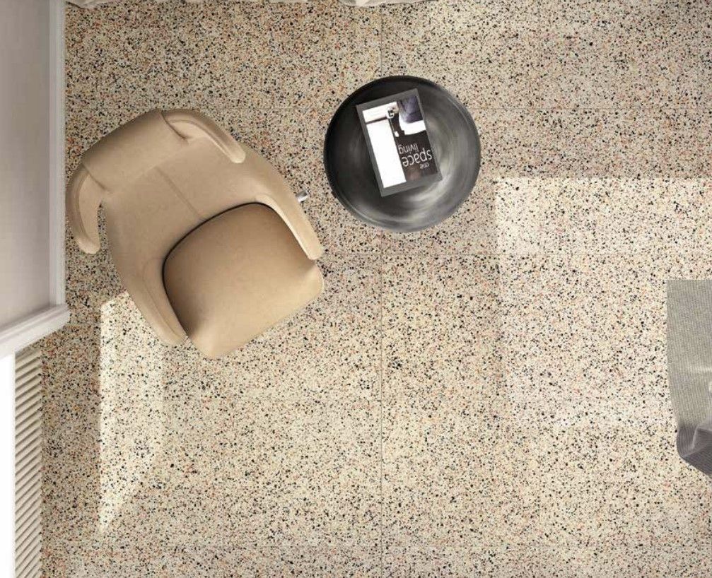 terrazzo tiles , beige chair with a black round table