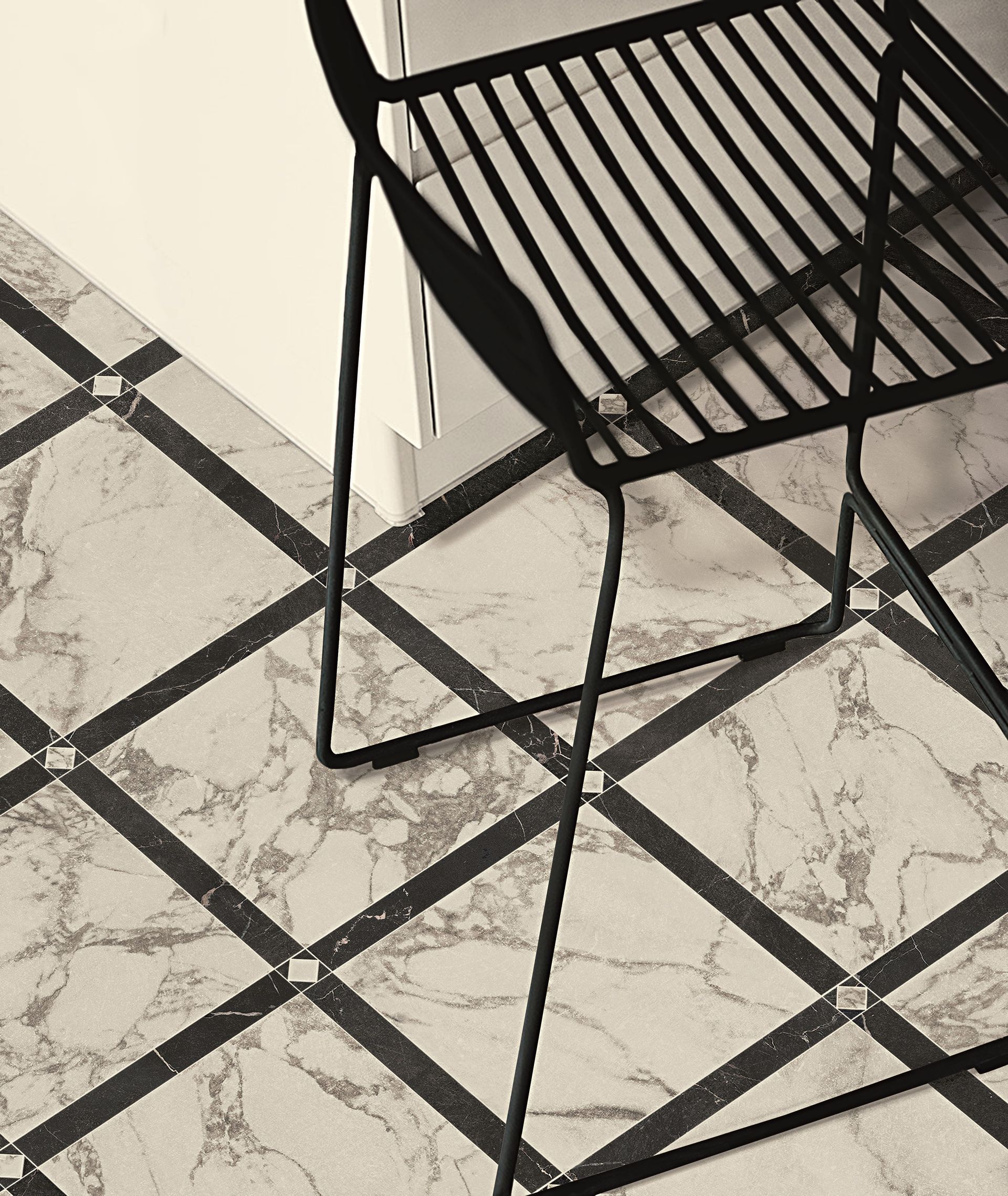 White marble effect tile with black marble effect inlay in chequer style floor.