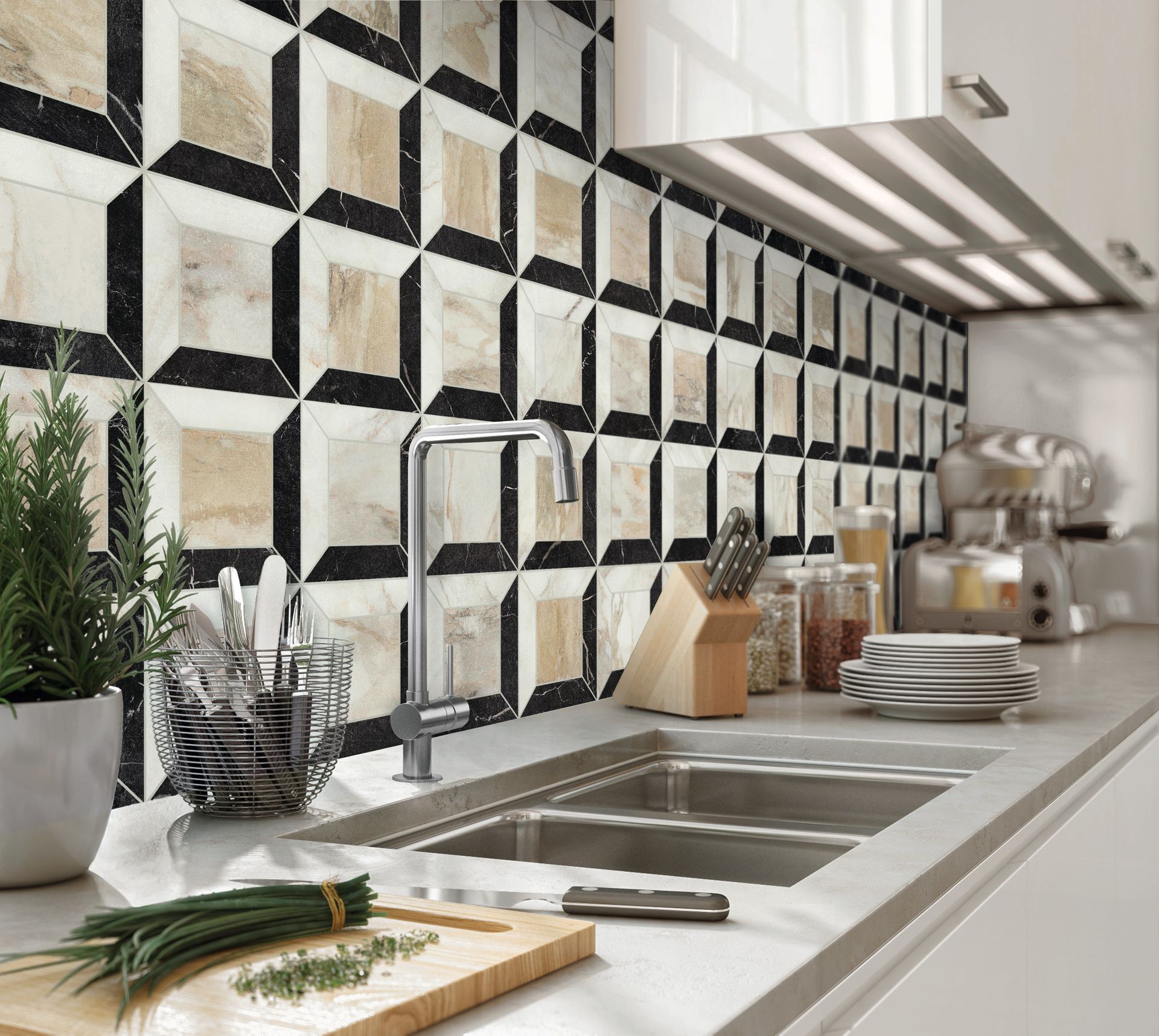 Modern kitchen with a striking geometric tile backsplash featuring a pattern of black, white, and beige tones, creating a visually dynamic design. The backsplash complements the sleek stainless steel sink and faucet set in a white countertop. On the countertop, a wooden cutting board with freshly chopped herbs and a knife sits next to a potted plant and a wire utensil holder. In the background, there are jars with ingredients, a set of knives, stacked plates, and a silver kitchen appliance, enhancing the clean and contemporary aesthetic of the space.