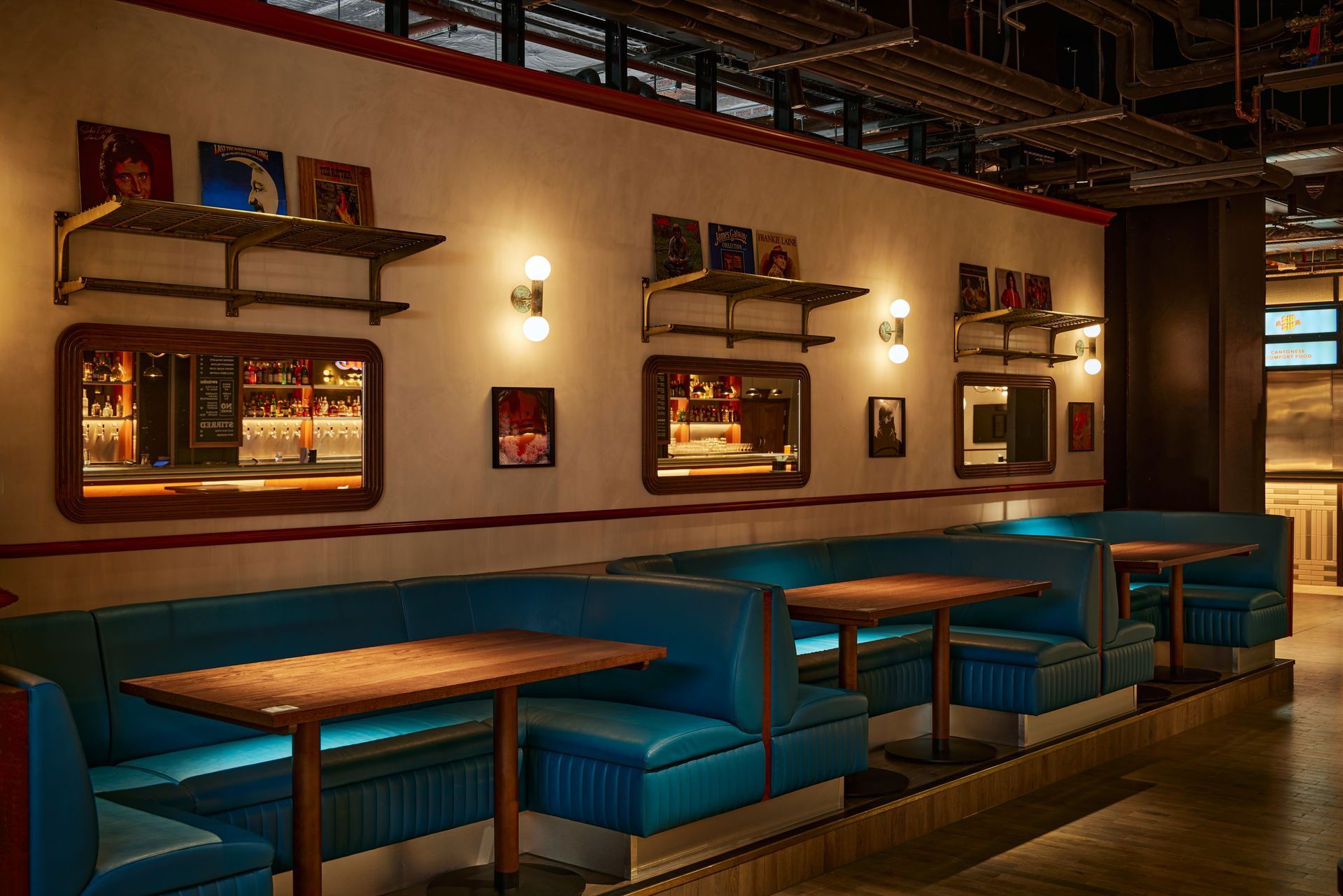 Seating area in the arcade food hall with blue seats