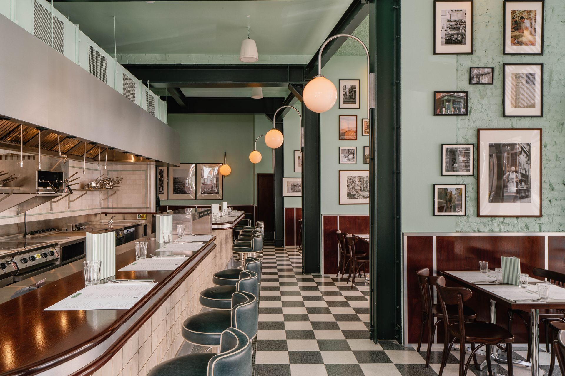 Real terrazzo green and white chequer floor tile in restaurant space.