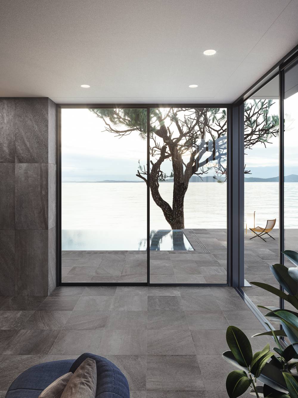 limestone effect tiles used in a home with floor to ceiling windows