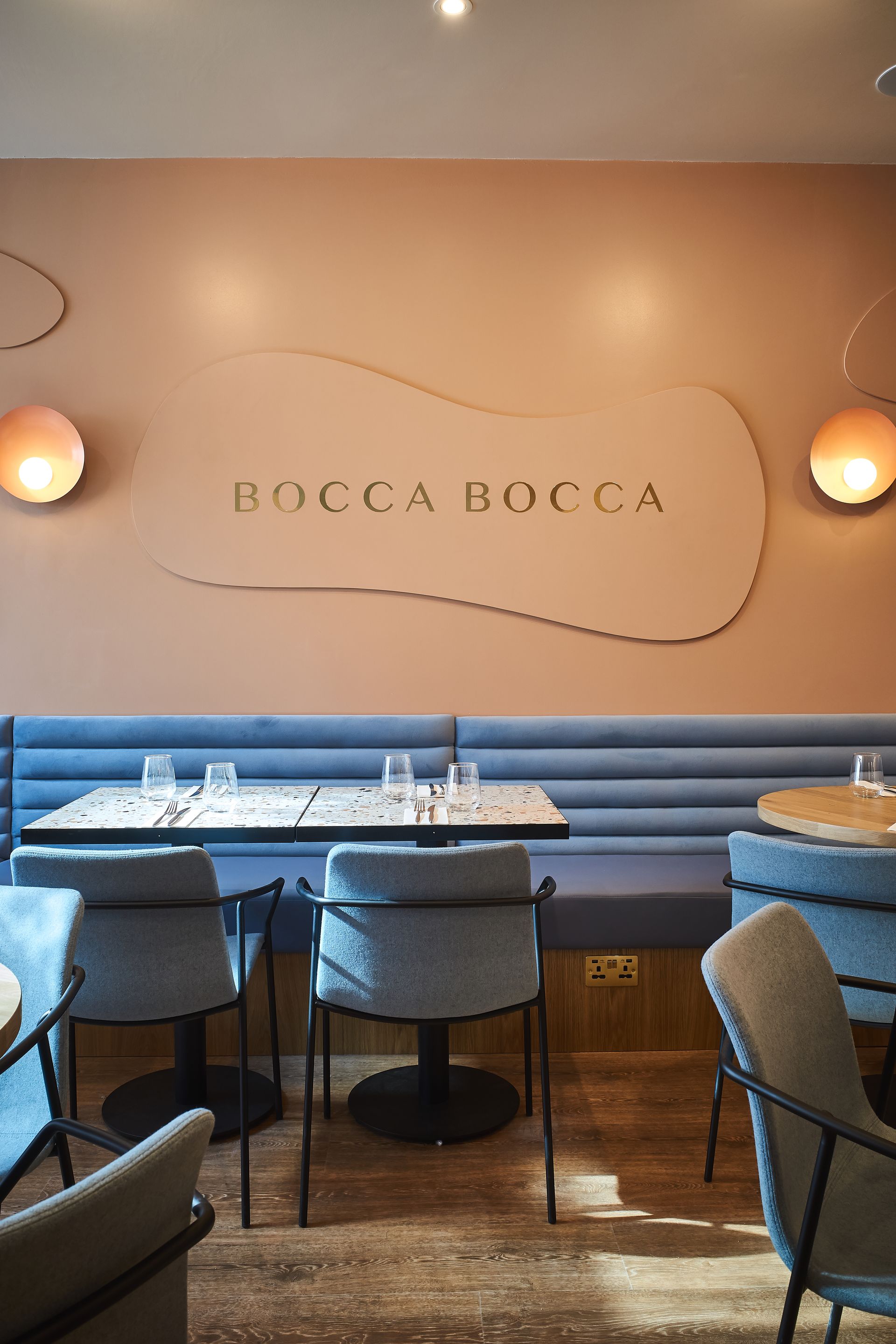 Restaurants seating area with blue bench and blue chairs