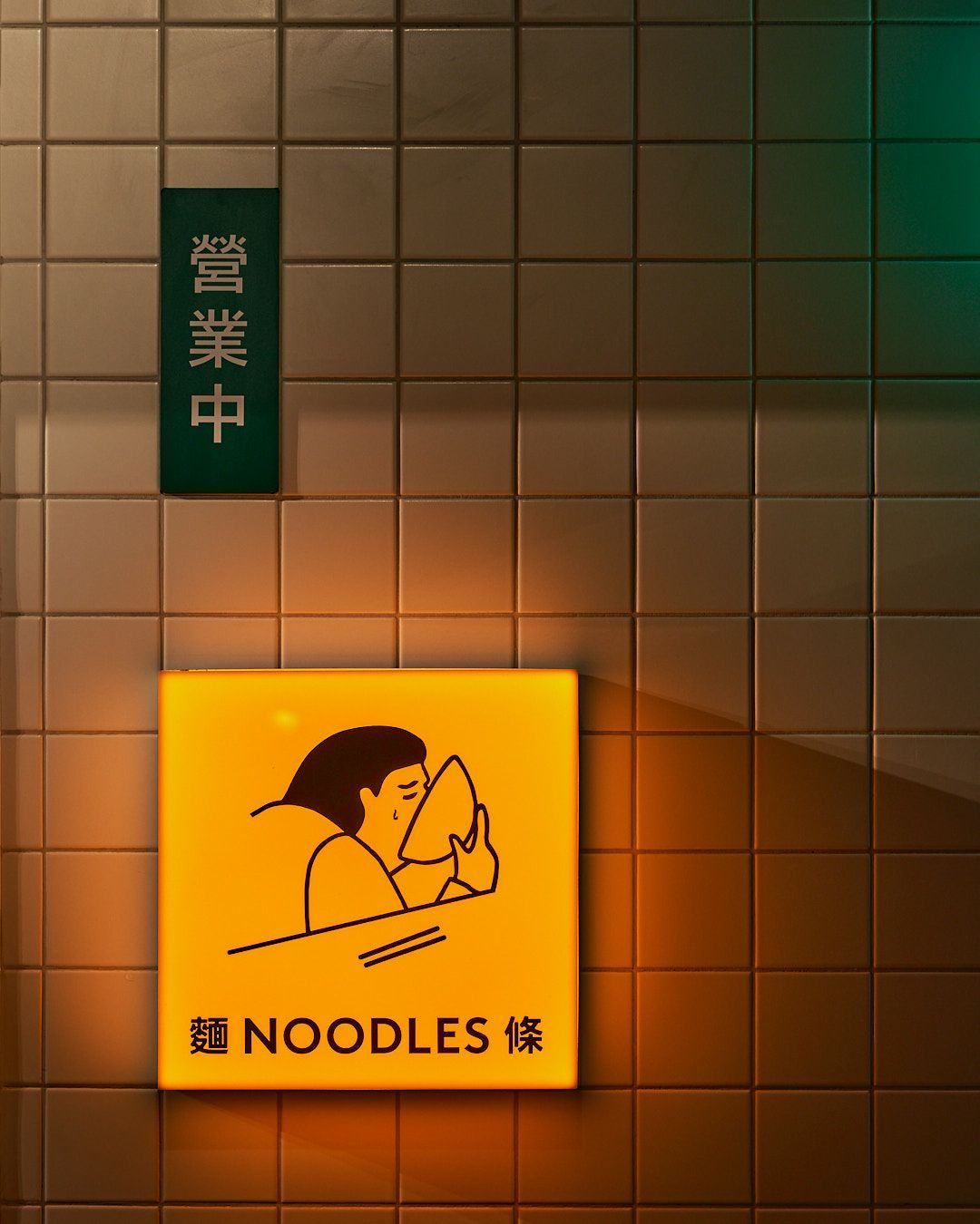 London Blanco tiles on the wall with a orange glowing picture of someone