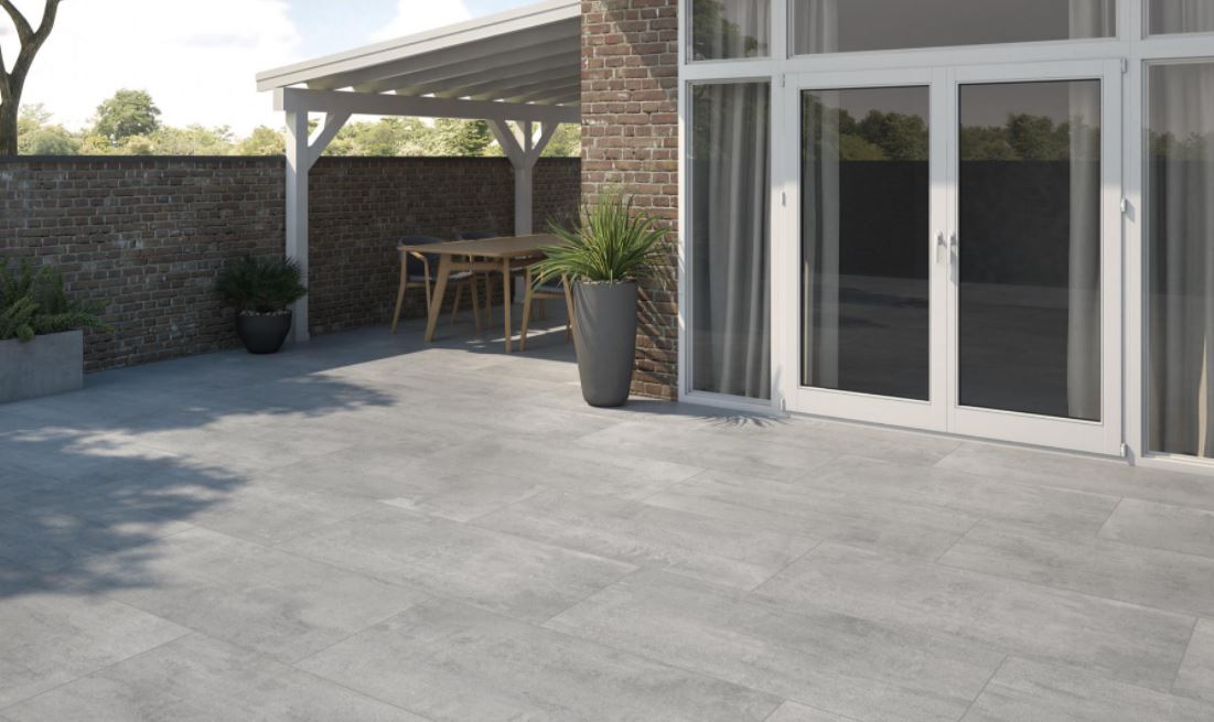 concrete floor tiles , outdoor patio modern design with a big plant