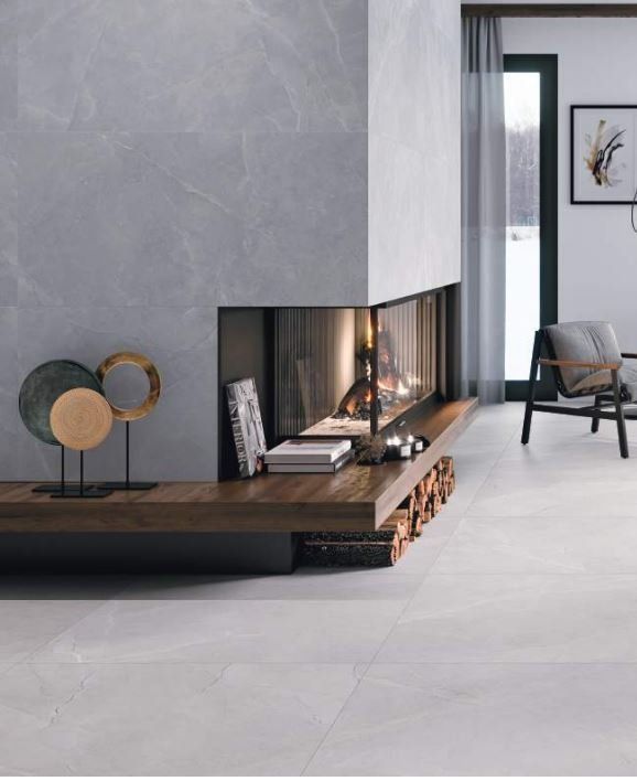 limestone effect tiles used in a living room setting with a fire place