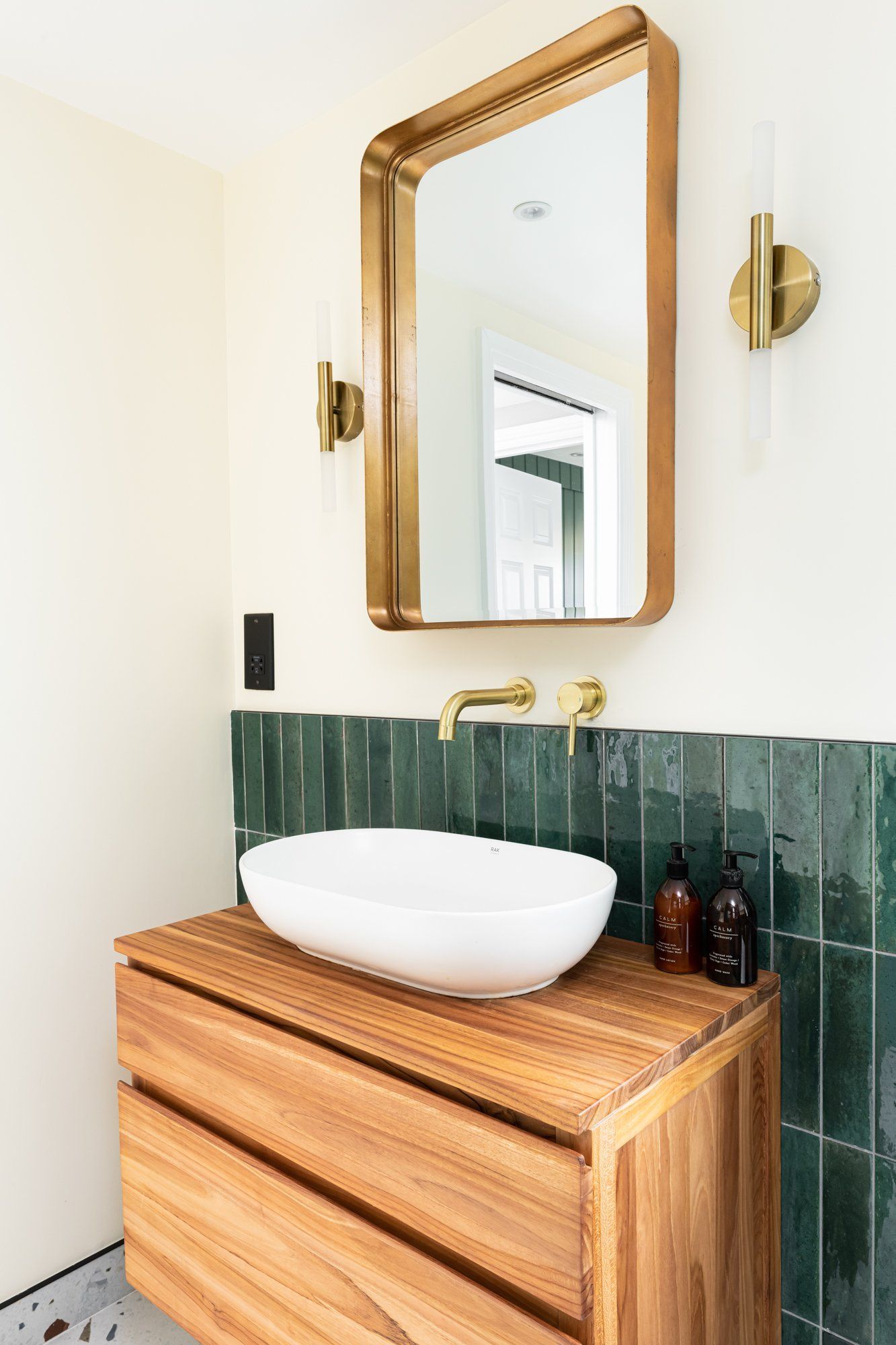 Golden Taps above sink with salerno verde tiles