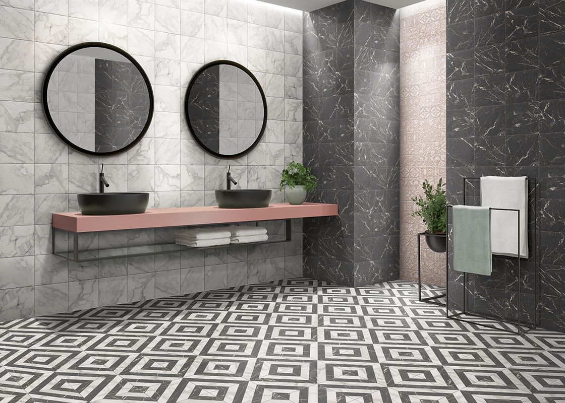 Bathroom room shot with pattern floor tiles and marbled effect wall tiles with black terrazzo feature walls
