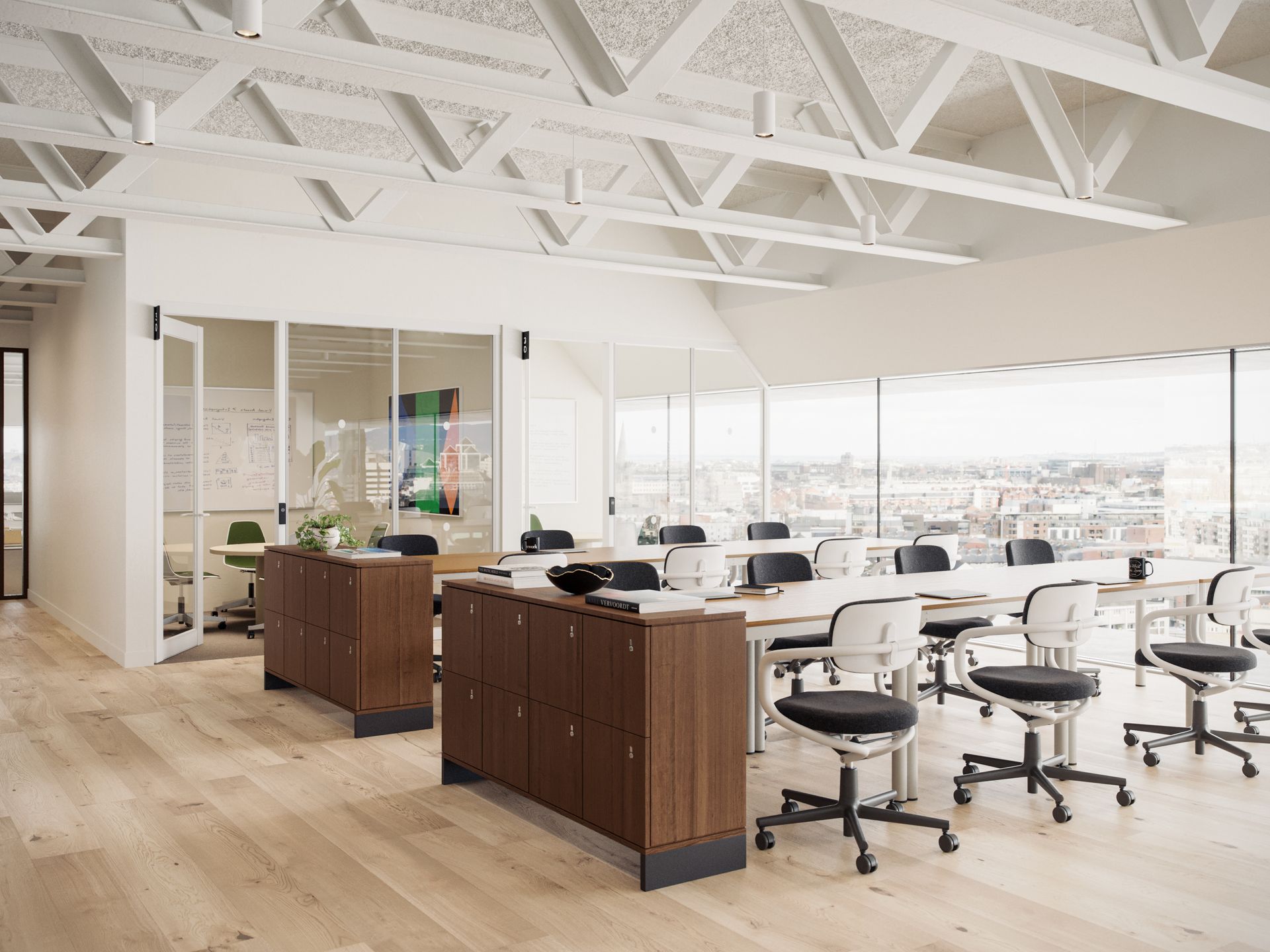 AN office room with desks and office chairs throught the whole room