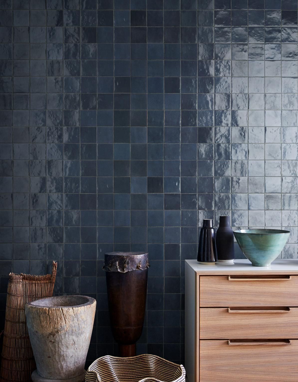 Tonal blue square gloss tiles shown on a feature wall