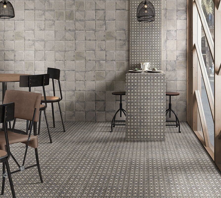 geometric pattern floor and wall tiles , rustic style cafe, wooden style chairs
