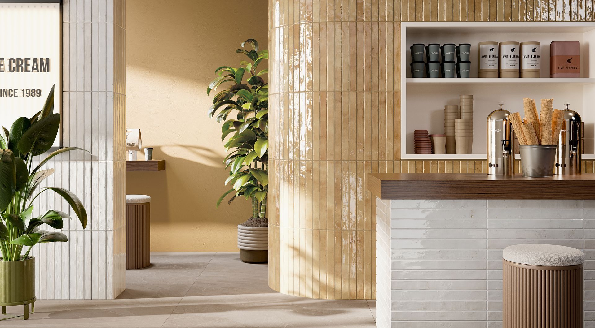 gloss brick tiles used on a rounded wall with modern style bar stools with a plant tree for decorations
