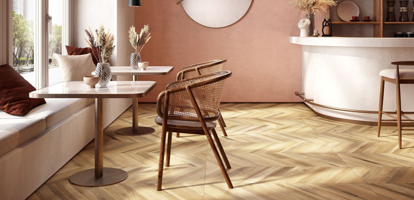 restaurant seating area with chevron wood effect floor tiles