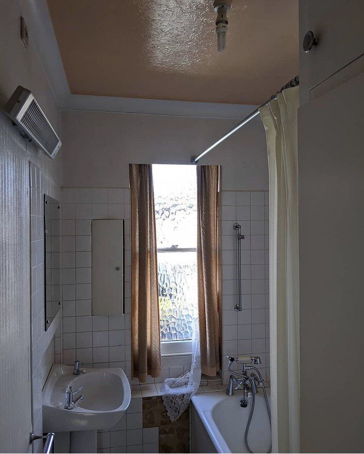 dated bathroom, prior to renovating