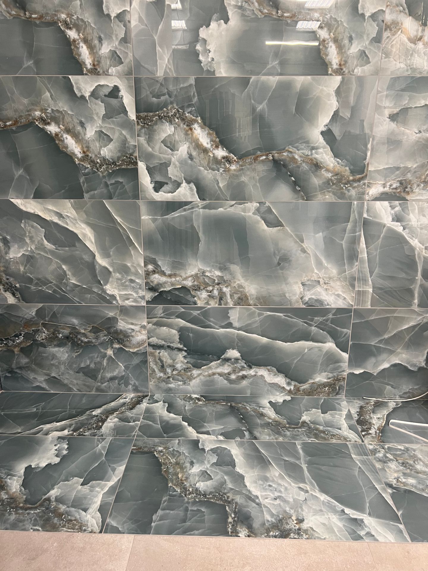 Sapphire gloss wall tile used in showroom and can be sampled for free