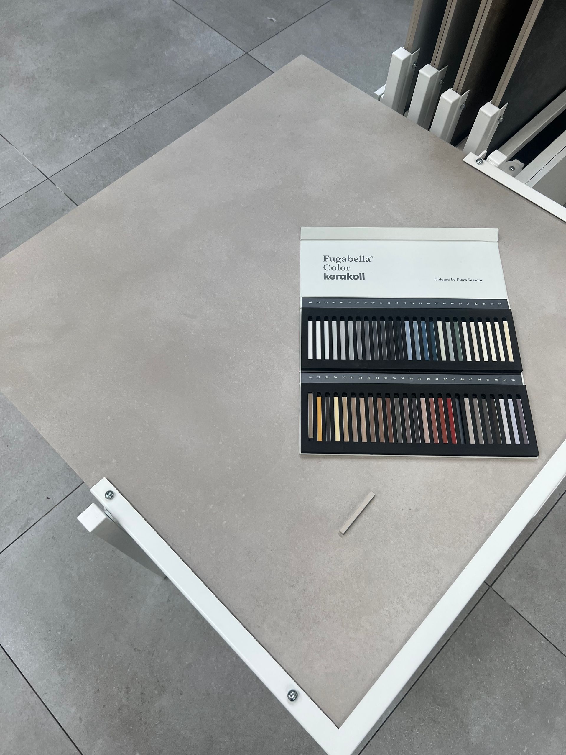 Grey floor or wall tile shown compared to grout chart