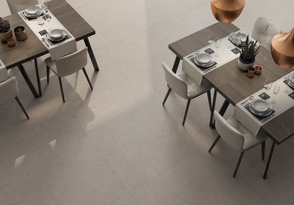large floor tiles , restaurant design , white chairs , dressed tables , white aesthetic