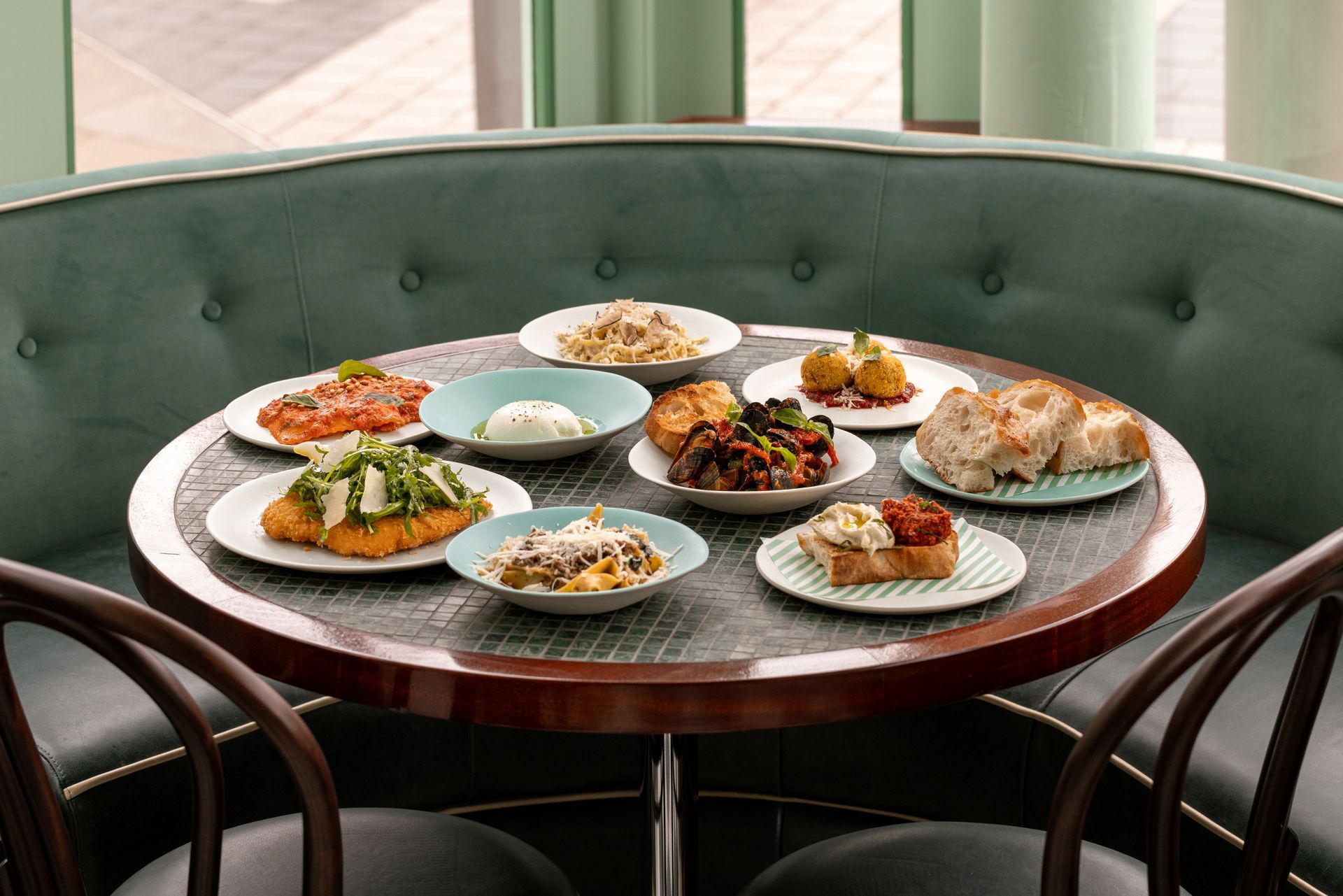 Lina south is kensington shown with a table full of food ontop of the custom tables