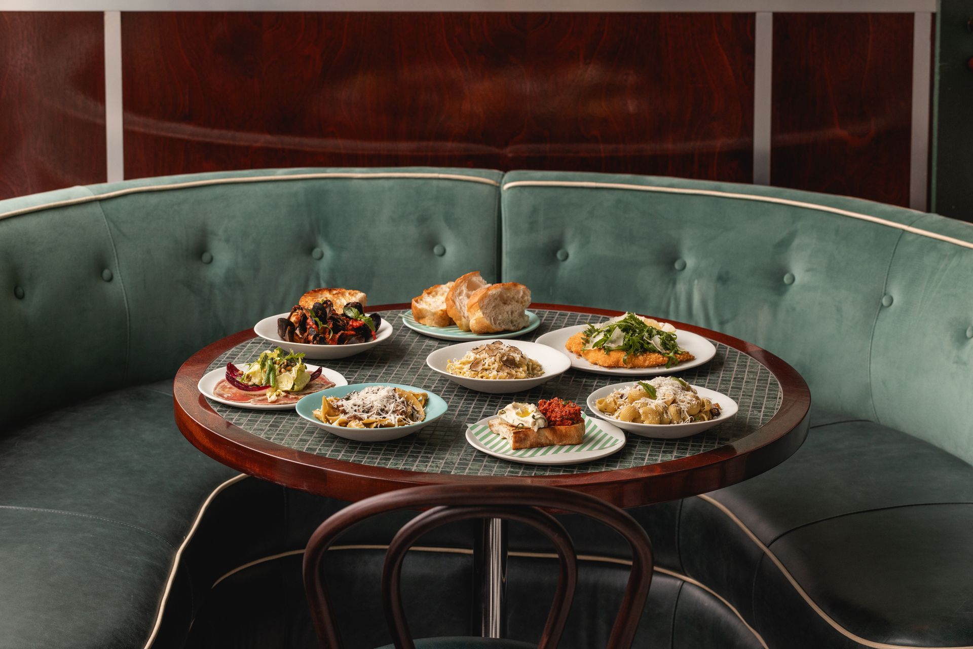 Bespoke mosaic and walnut table in restaurant