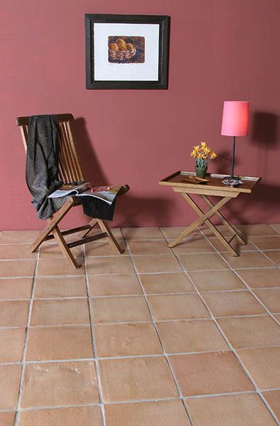 Natural Terracotta floor tiles used inside at a indoor seating area inside this house