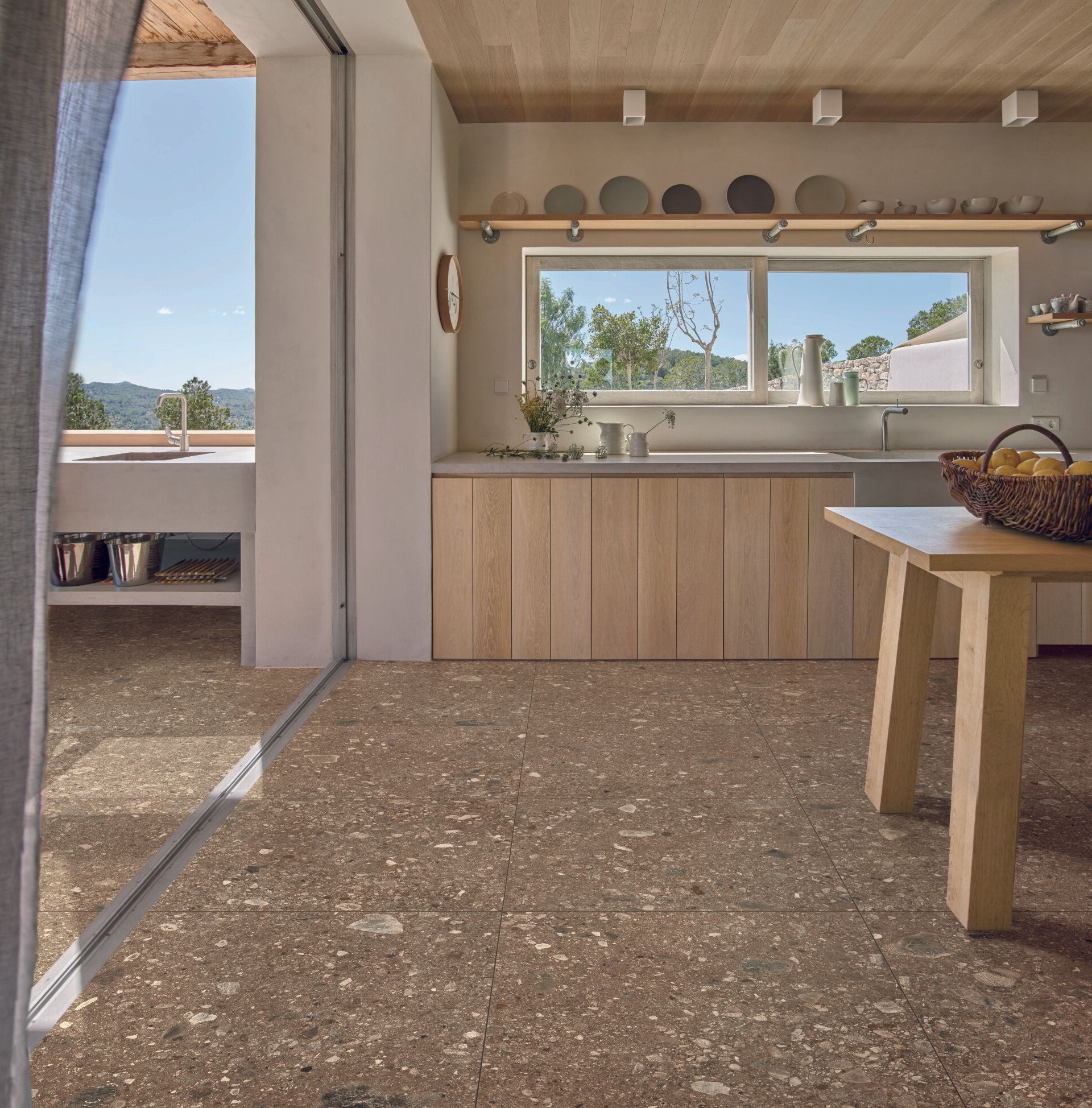 terrazzo effect tiles , used in a vintage aesthetic kitchen design with wooden features