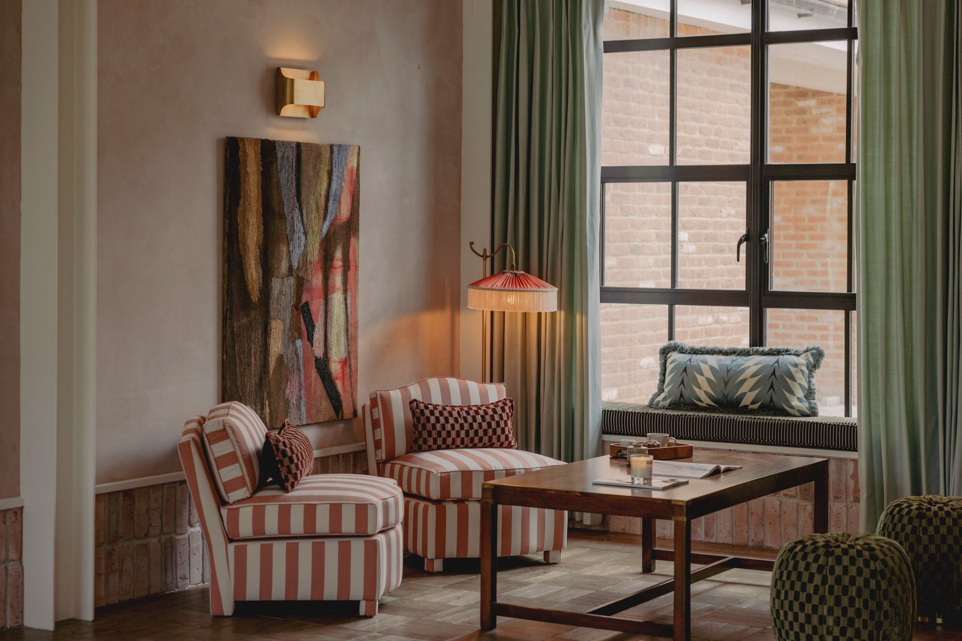 another social area in the golf lodge with 2 chairs and a table