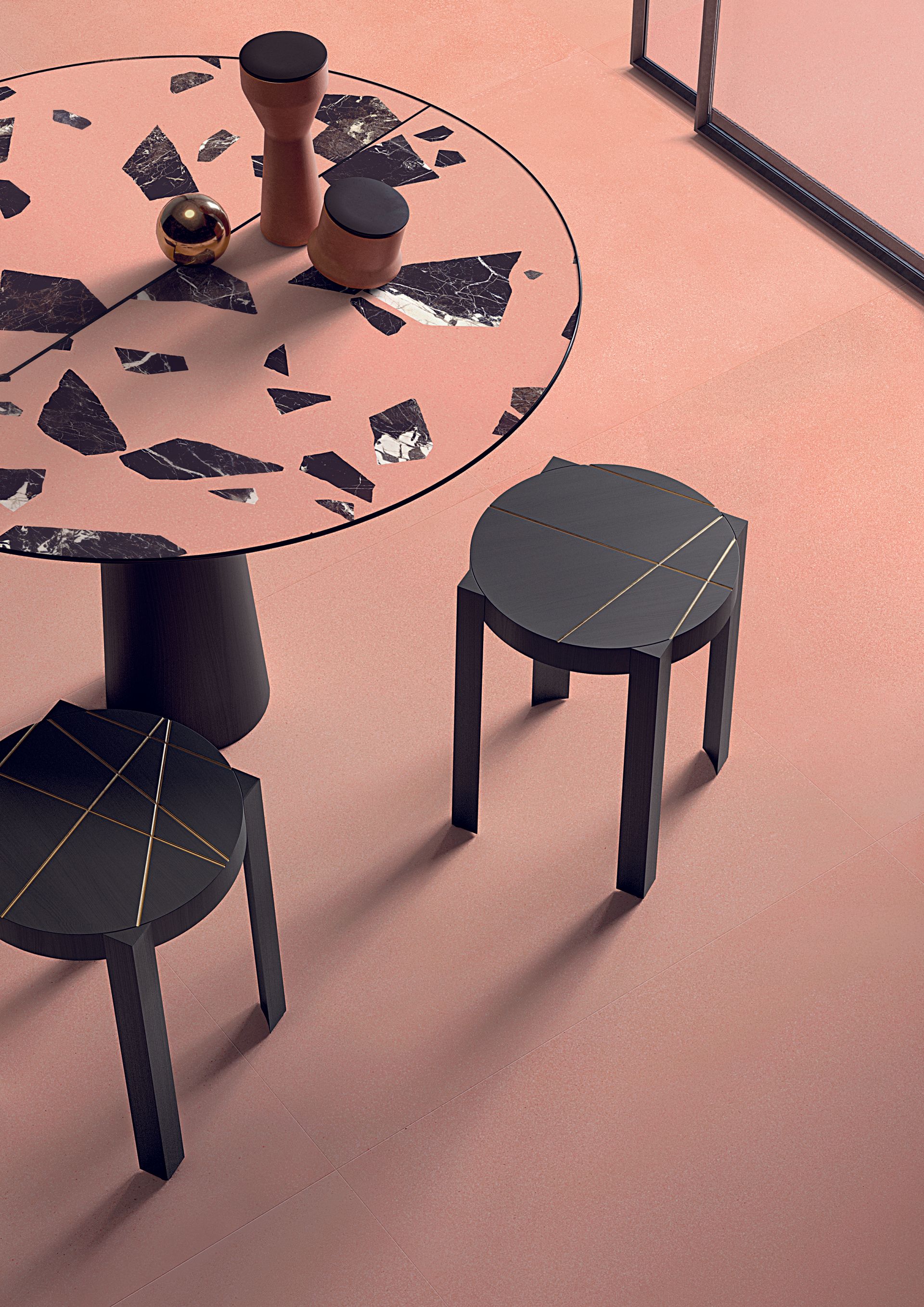 terrazzo tiles, black stool bedside table with gold accents