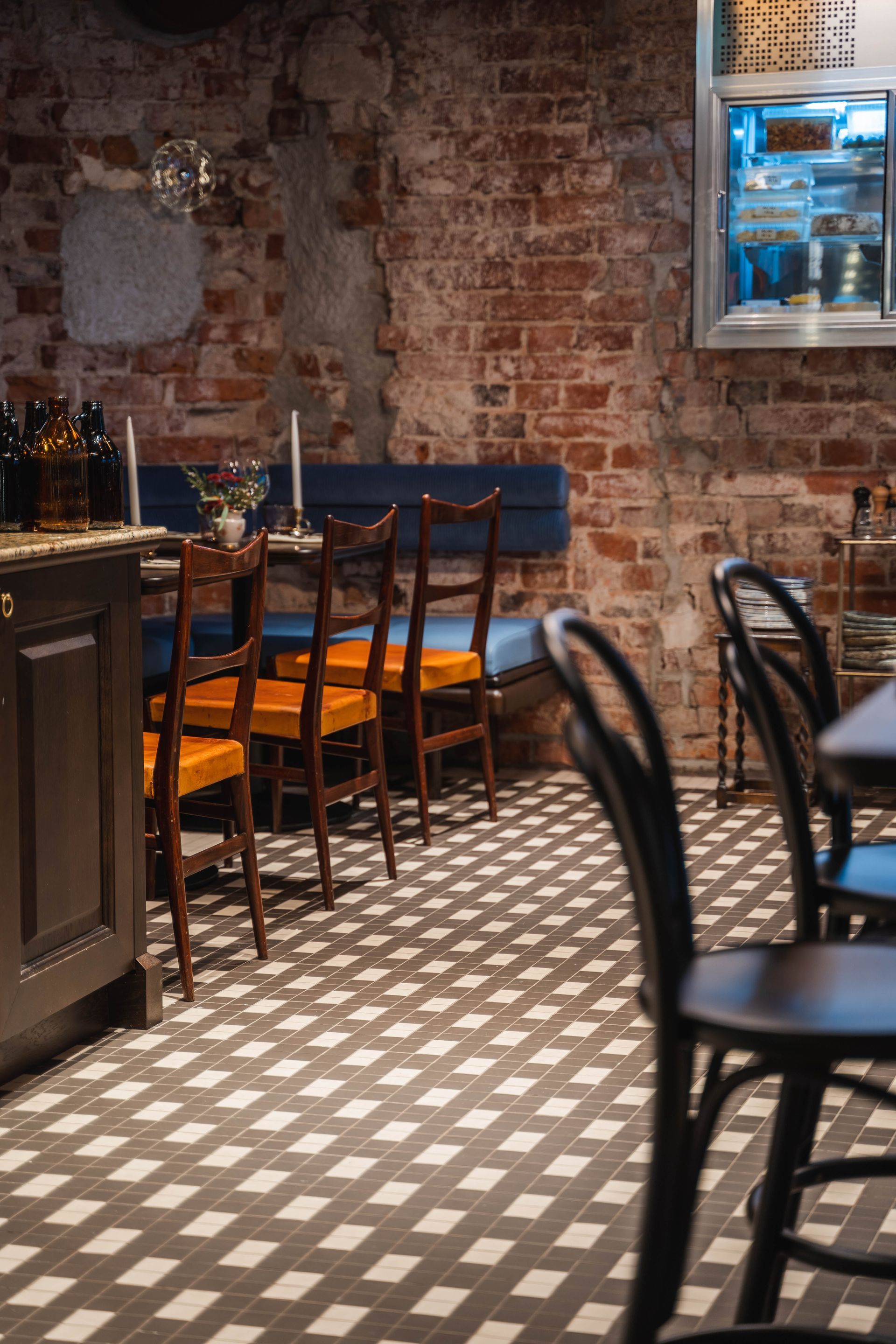 Chequerboard effect floor pattern in restaurant seating area