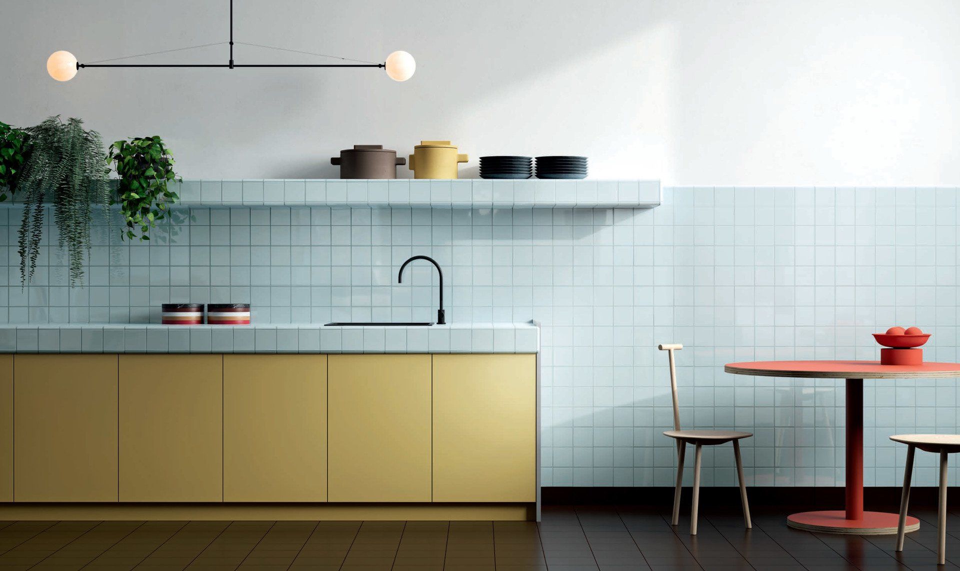 Kitchen with red table and chairs with a blue feature wall with palette ral on it