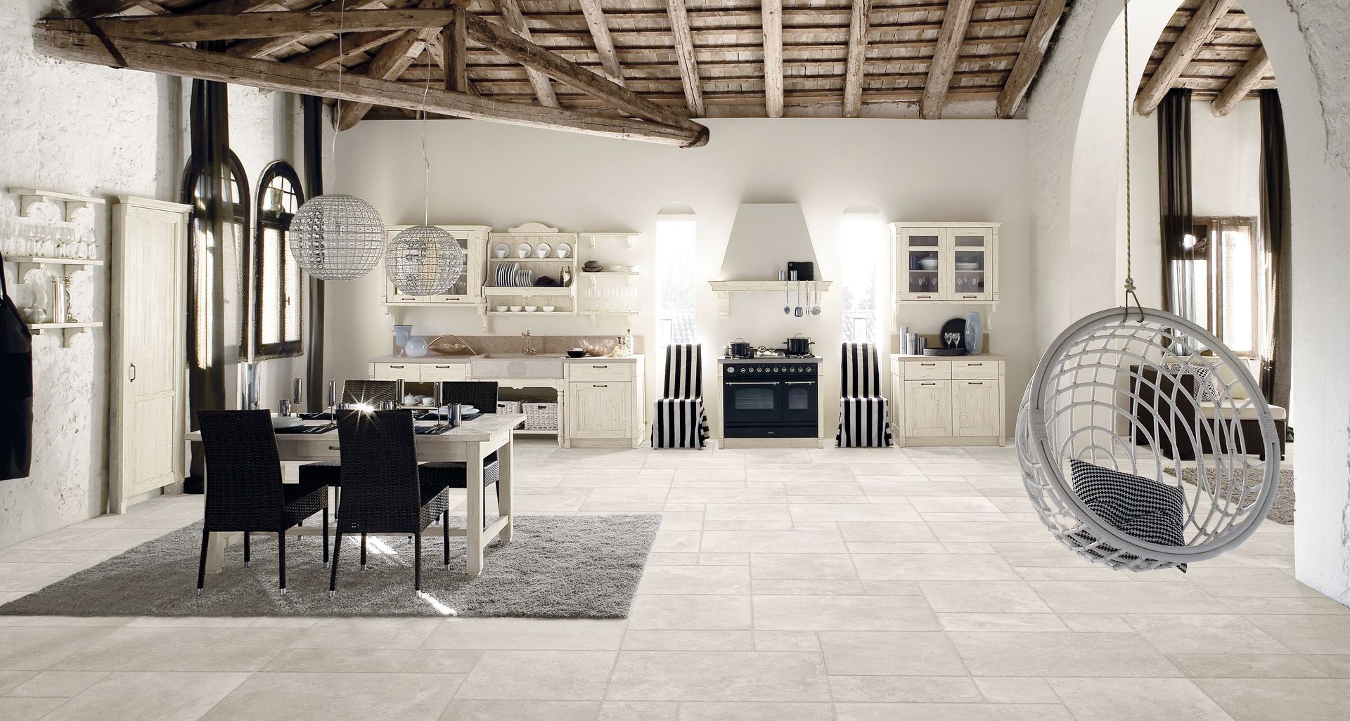 limestone effect tiles used in an open floor tile with a swing tile with wooden beam ceilings