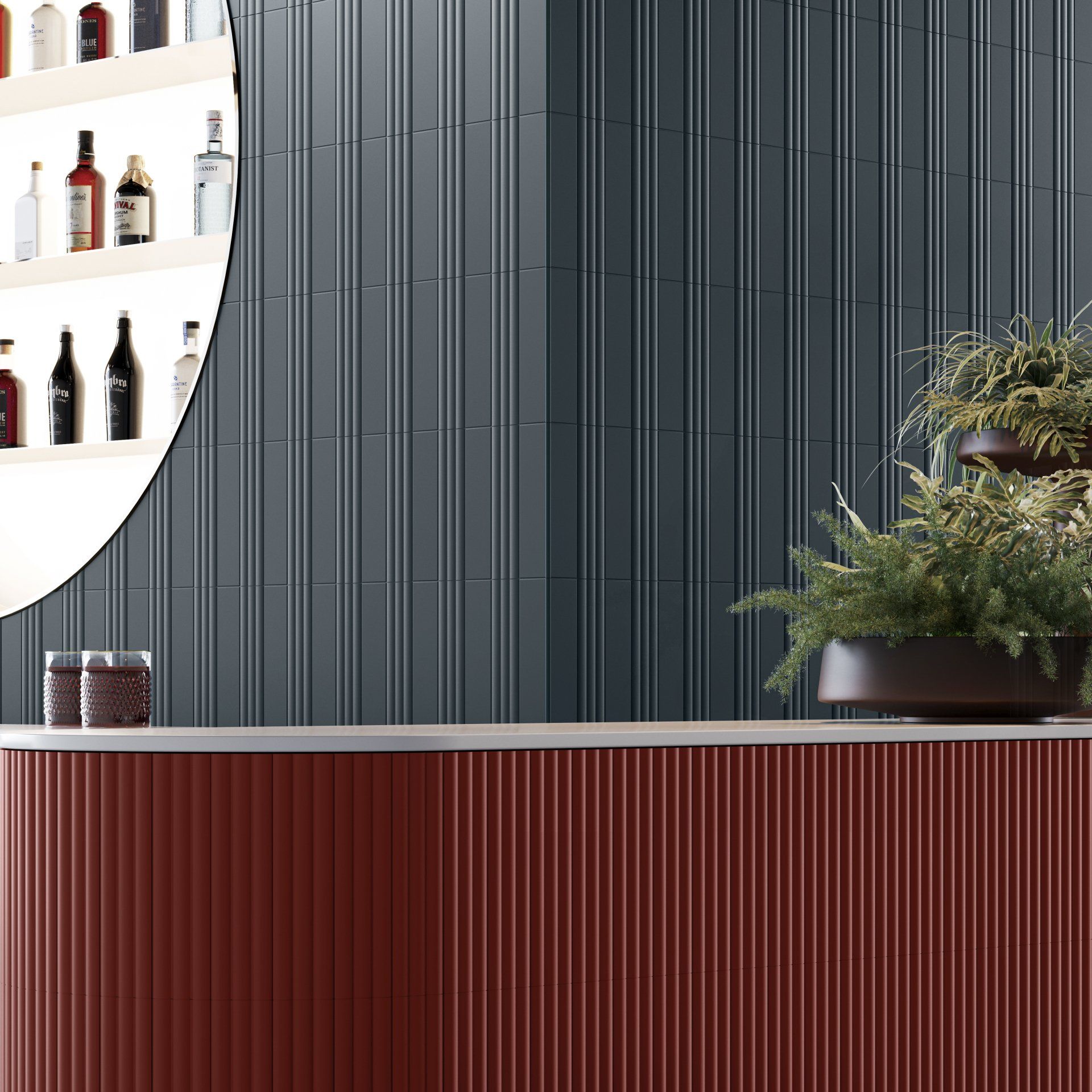 A red bar front made from fluted tiles as a feature with dark blue velvet seats and wine glasses on the coffee table infront