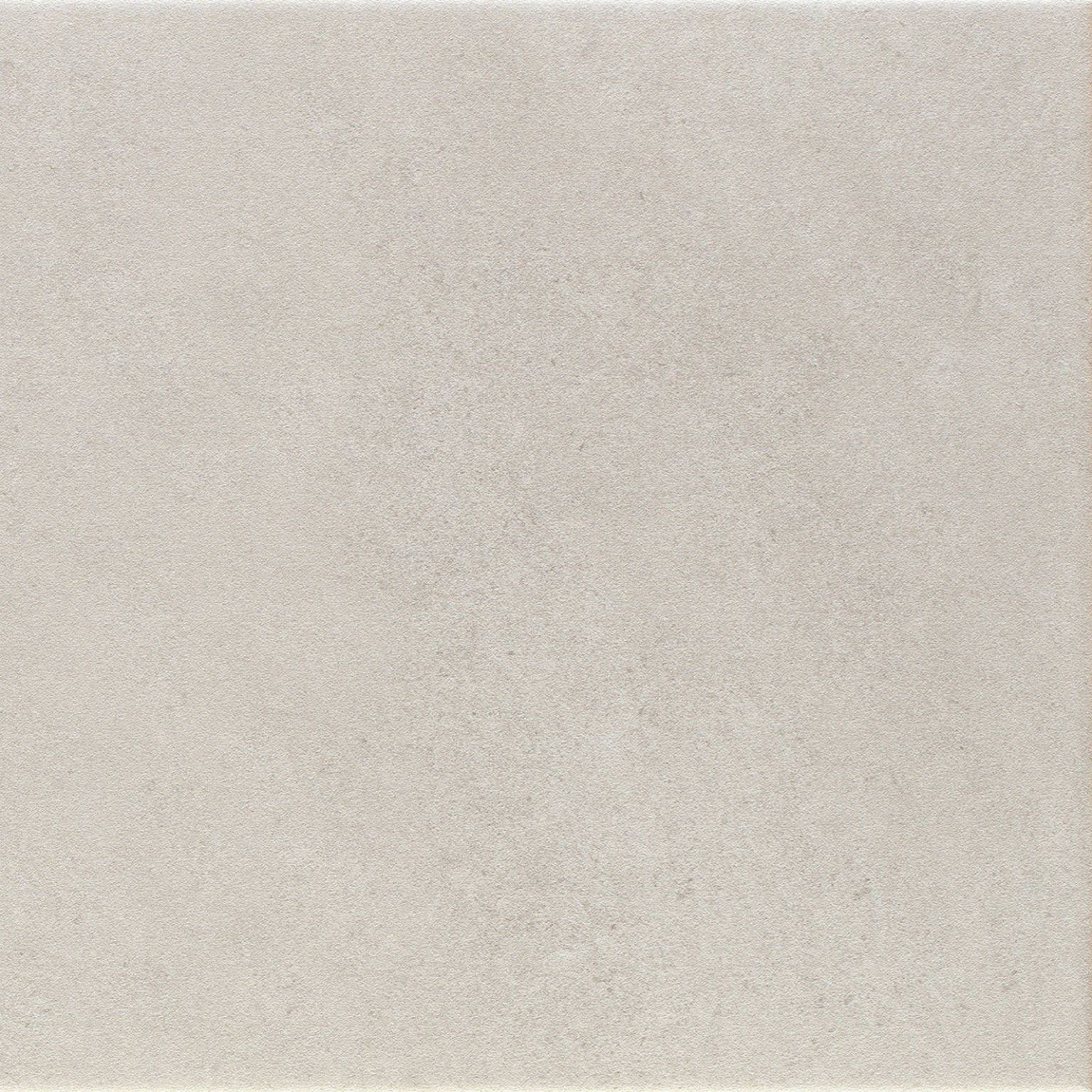 Close-up of a smooth light grey tile surface, showcasing the texture and neutral tone ideal for modern interiors.