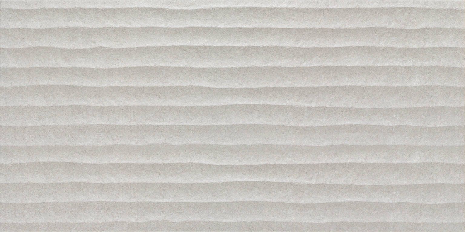 Close-up of a smooth light grey tile surface, showcasing the texture and neutral tone ideal for modern interiors.