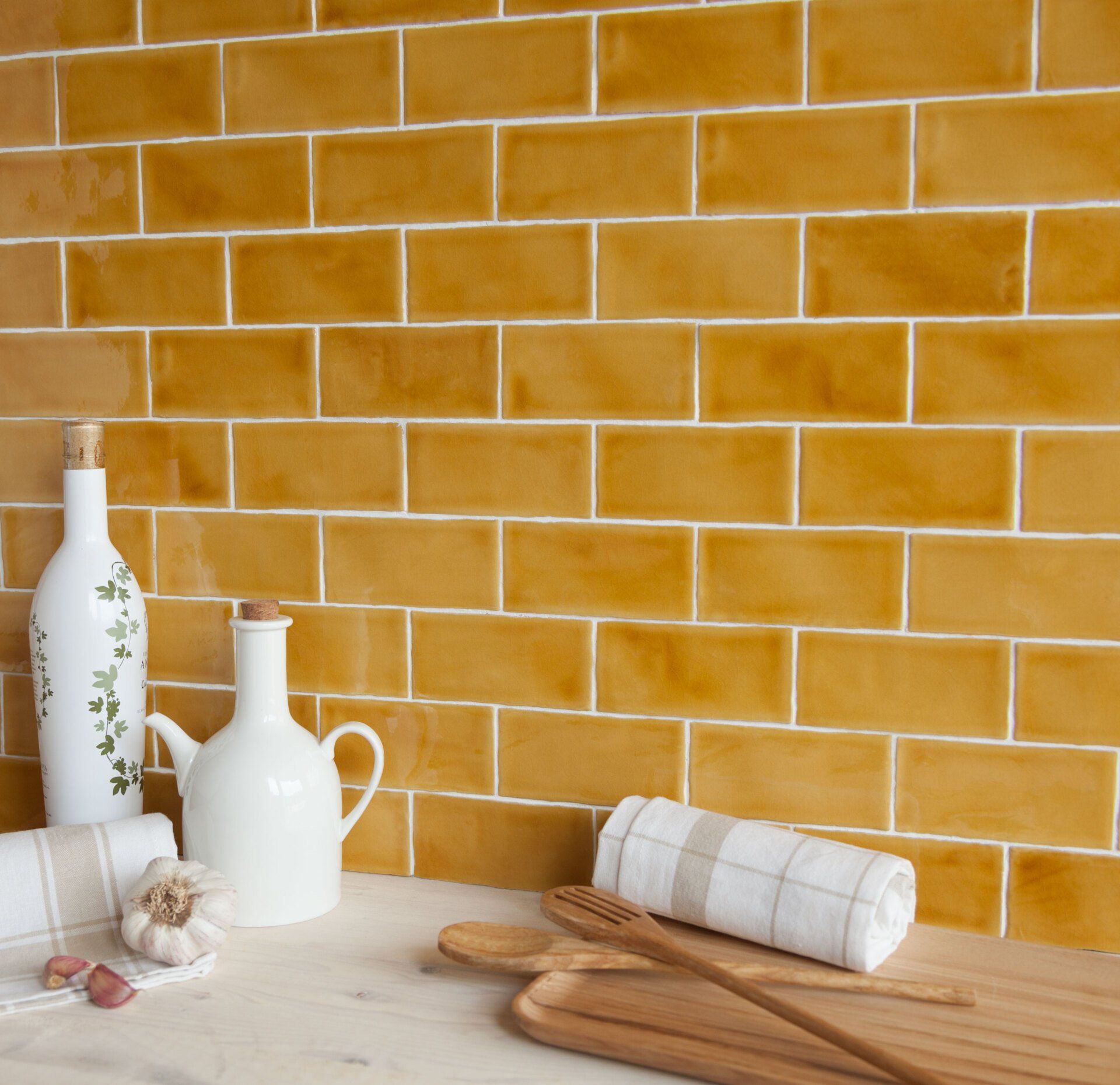 Faro gloss mustard wall tiles used in a modern kitchen