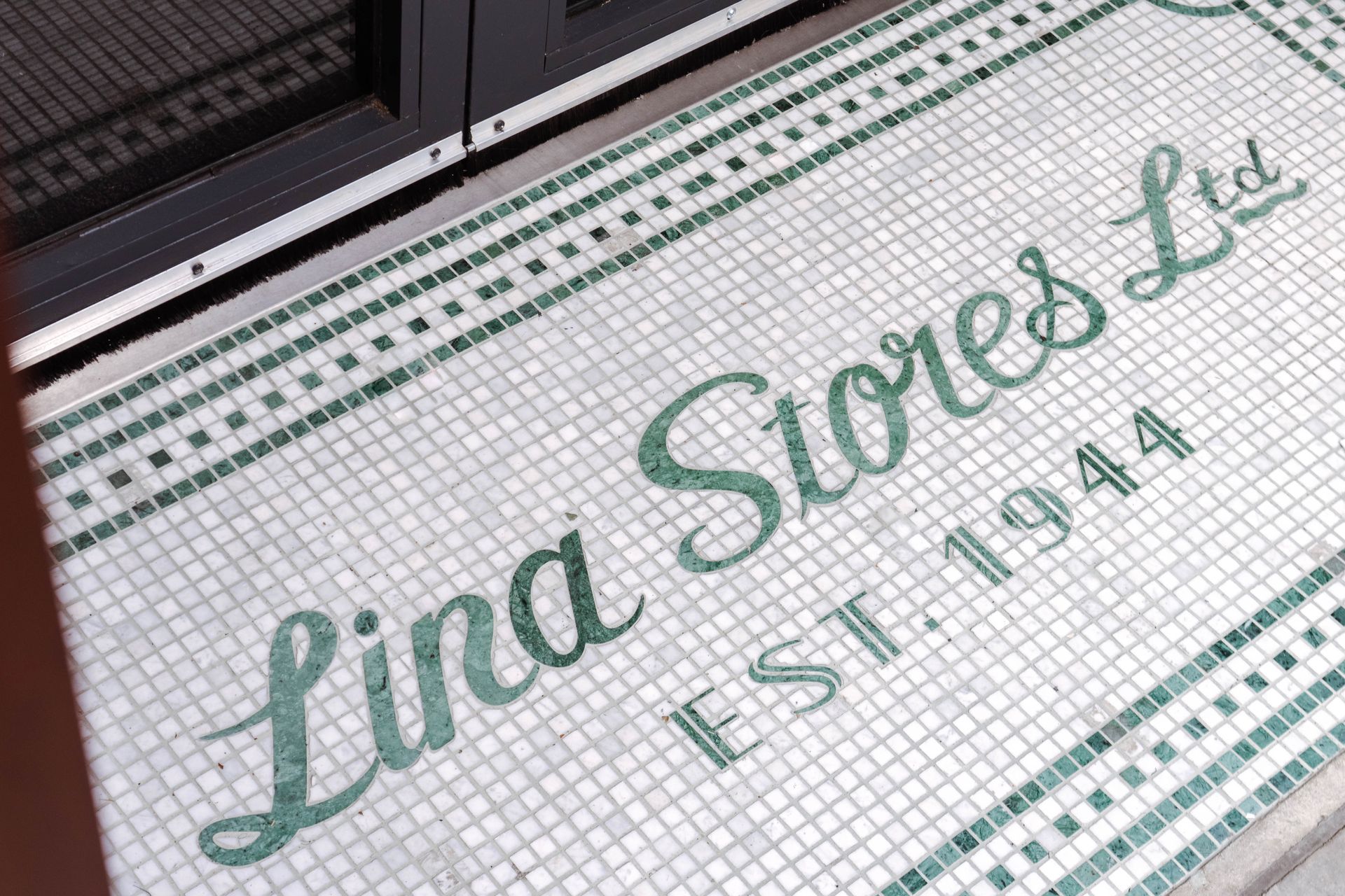 Bespoke Mosaic storefront walkway logo made from tiles