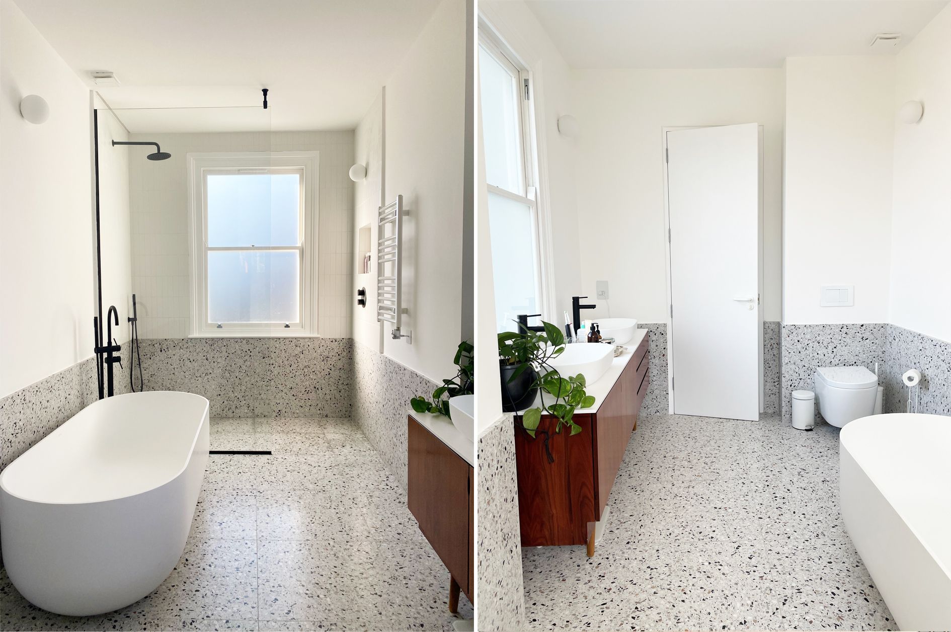 a terrazzo floored bathroom with a large bath and white walls