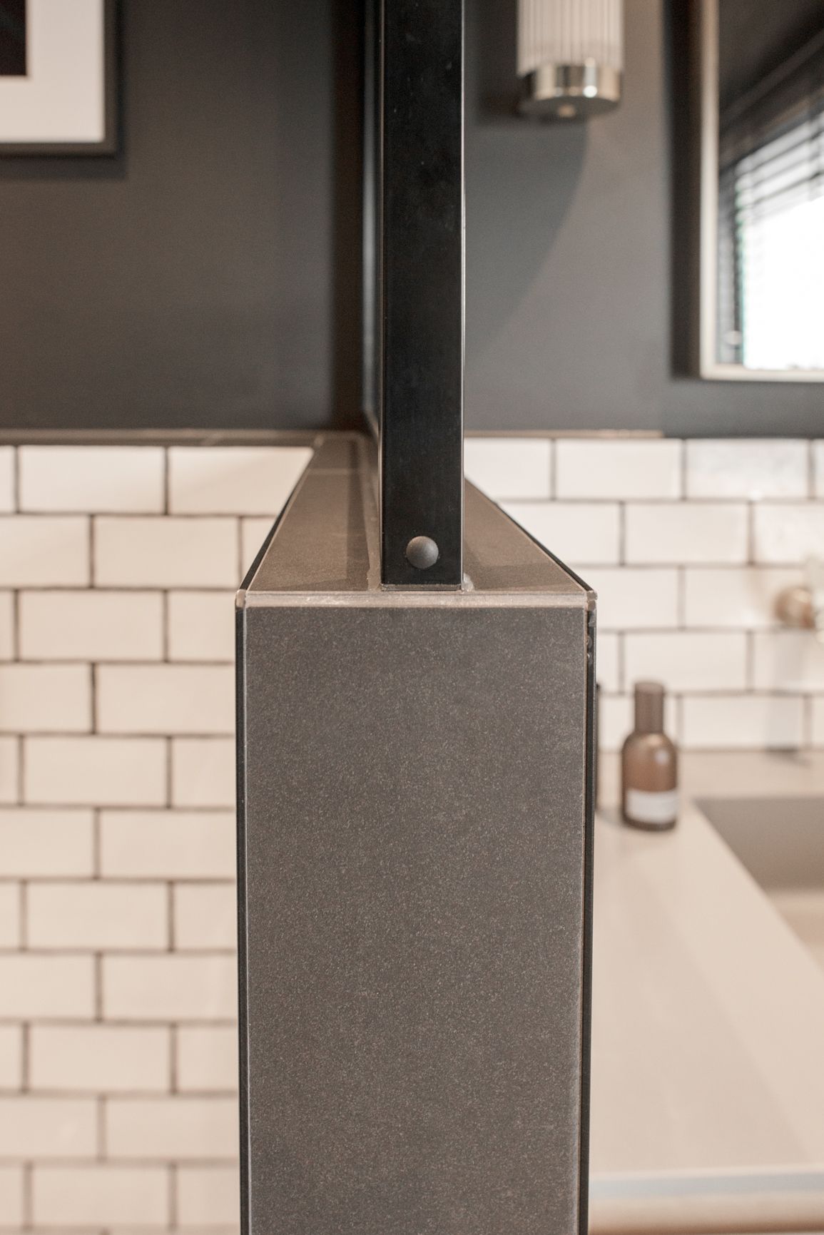 Close up of a Shower glass pane connected to tiles