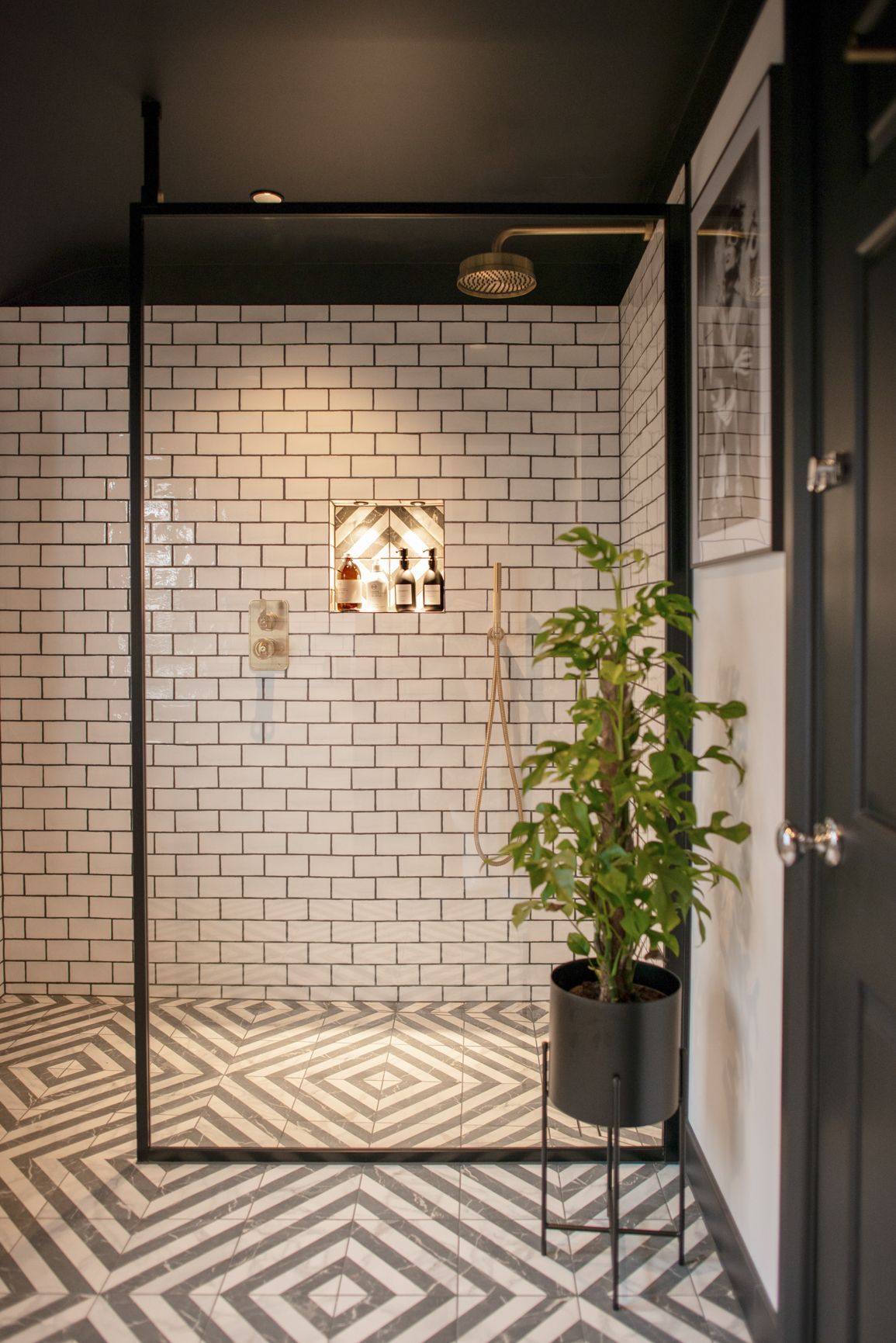 green plant in bathroom with farmhouse metro brick tile in the wall