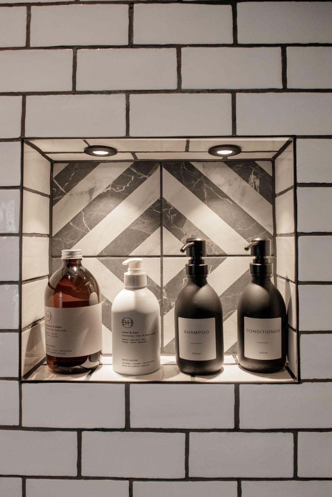 close up of pattern tile and 4 body wash products