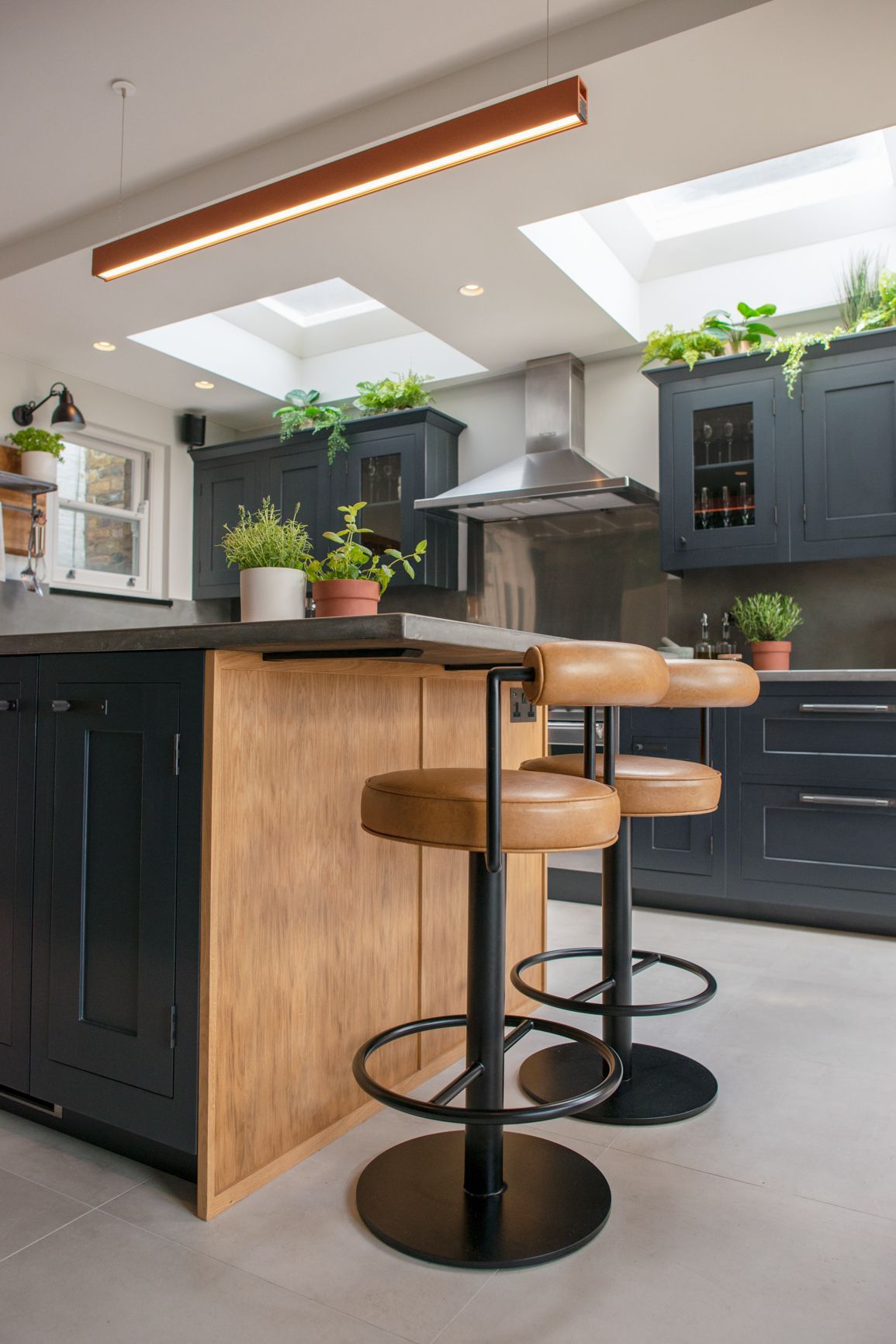 Close up of dining room With potted plants and brown seating