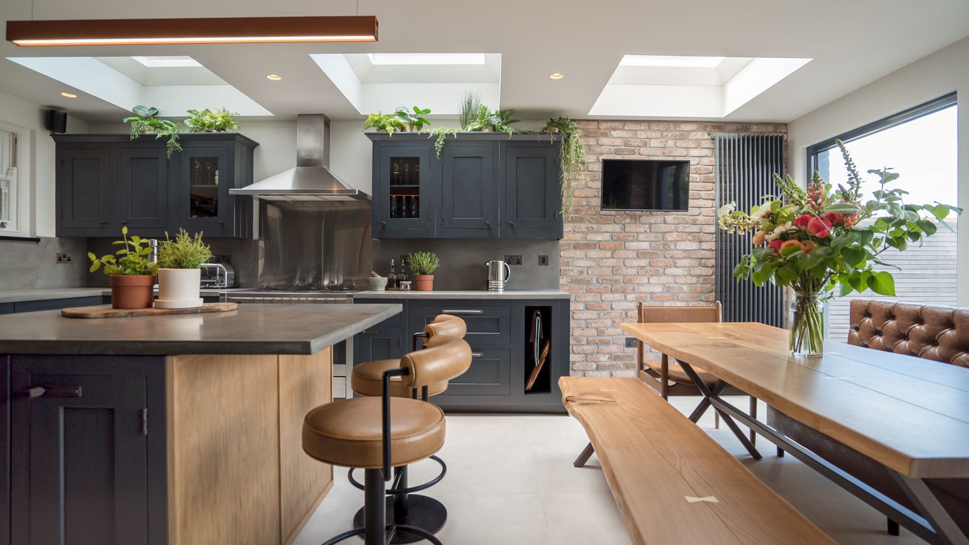 Limestone effect tiles on the floor under bench and chairs