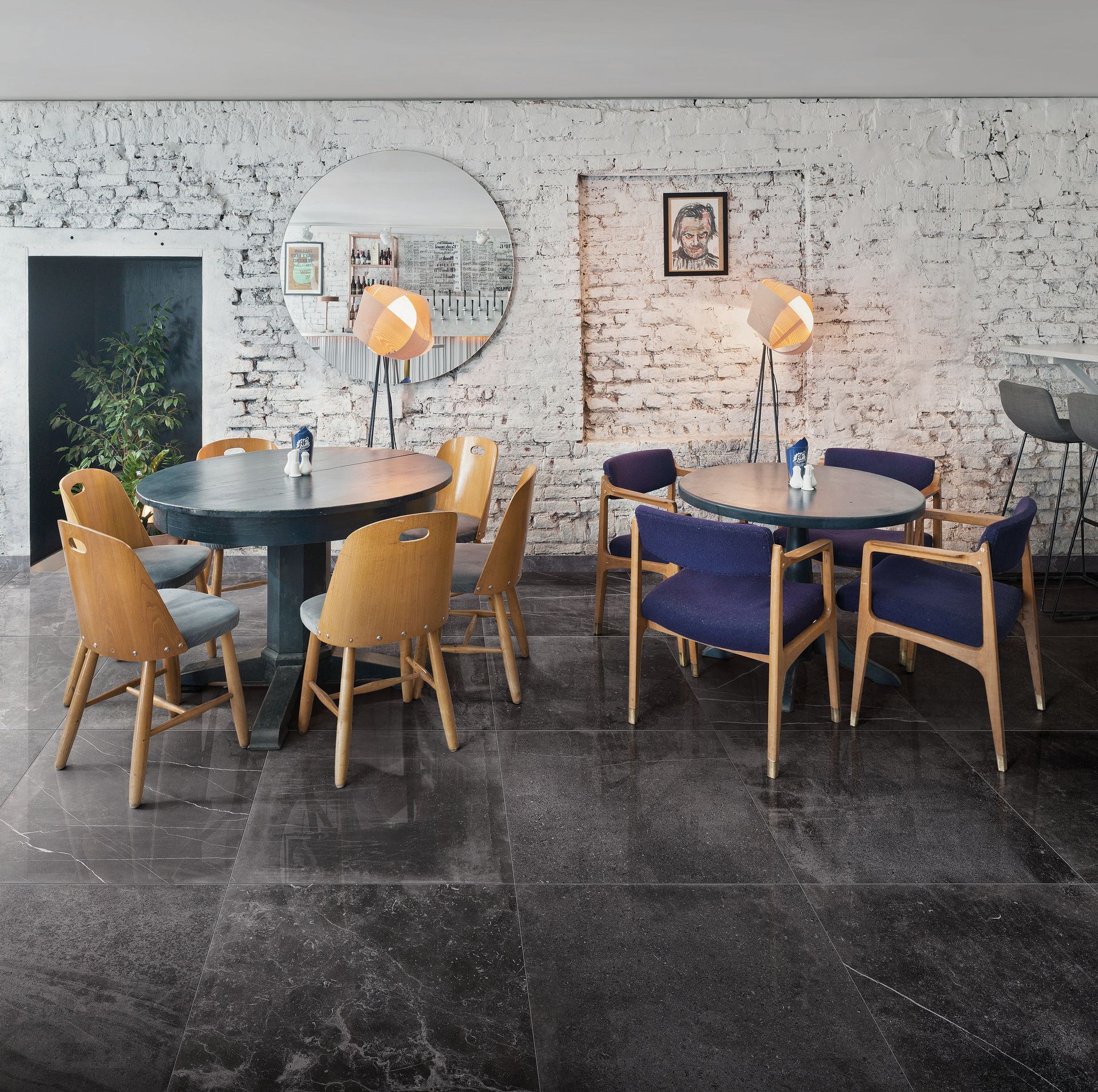 Resturant eating area with 2 tables and 8 chairs using Concrete effect floor tiles
