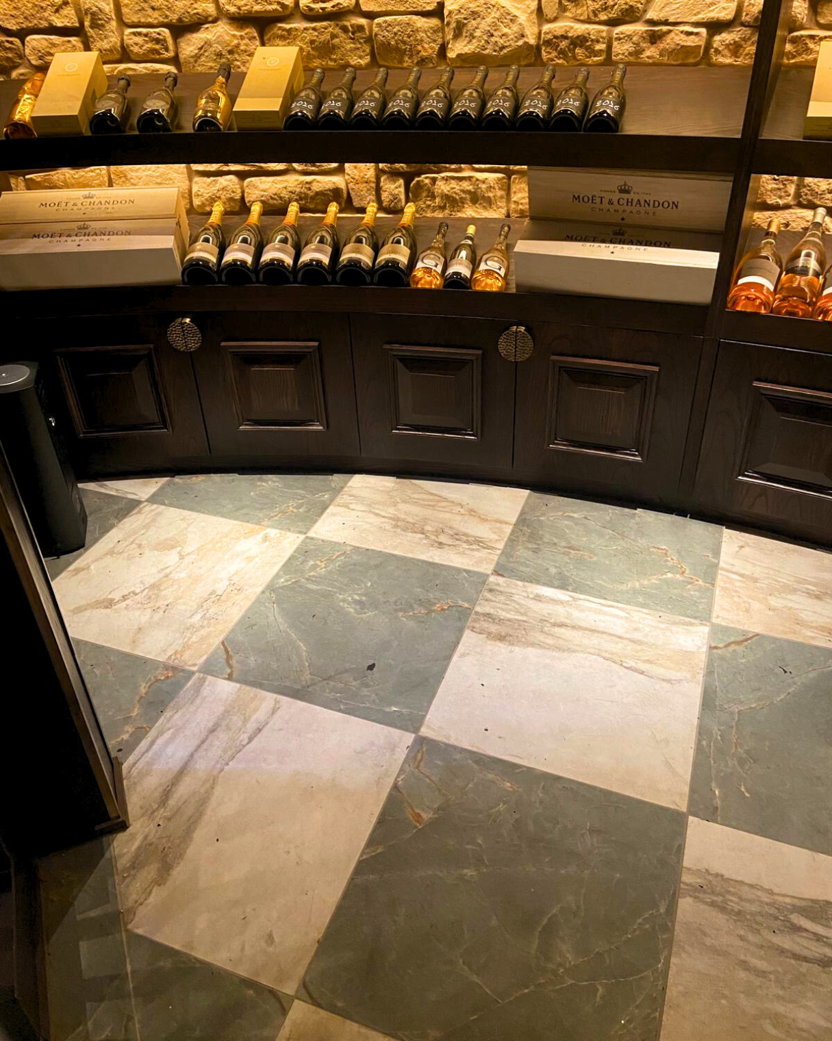 fancy wine room at the cut and craft bar featuring chequer effect floor tiles
