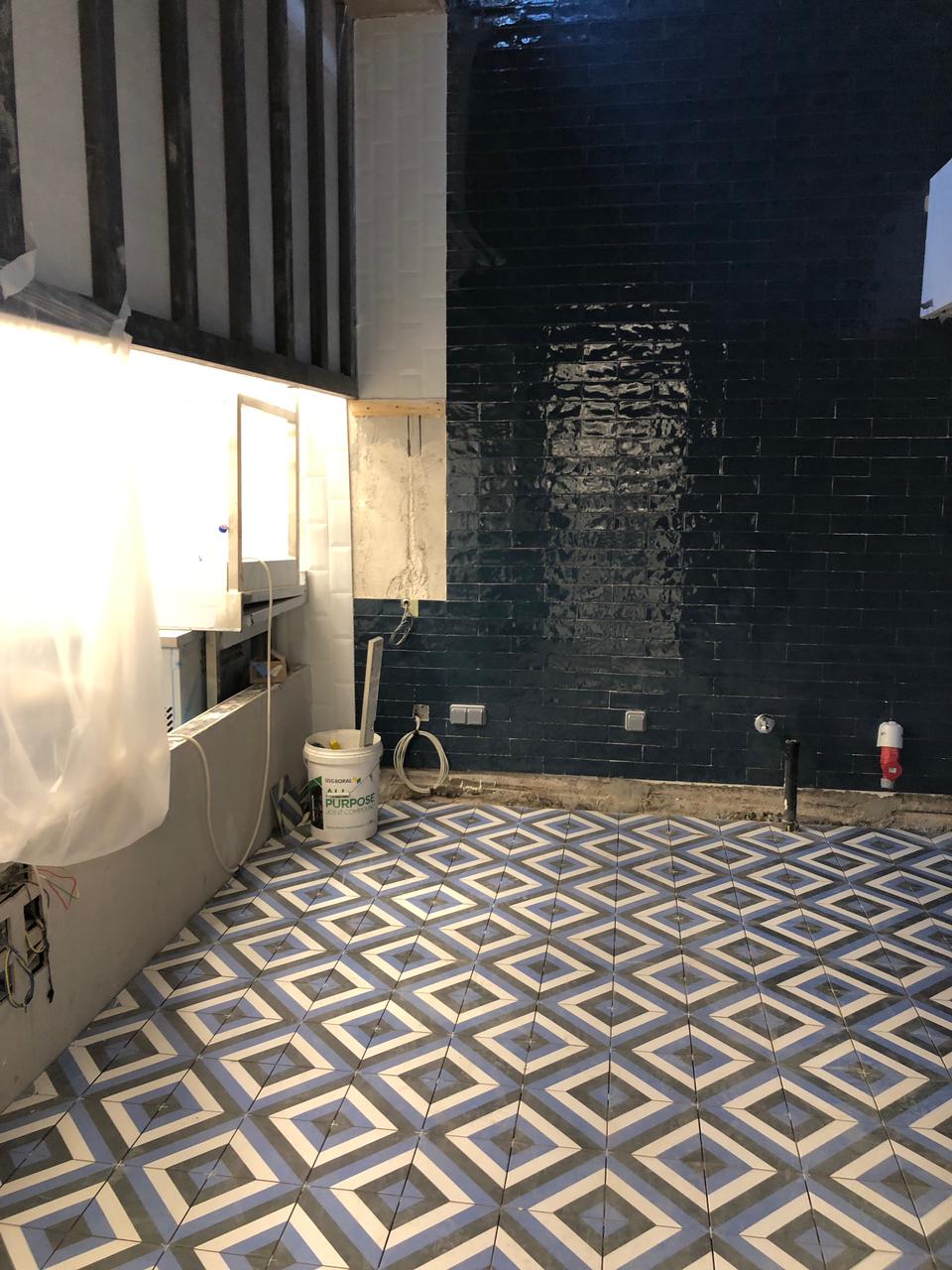 blue pattern floor tiles and zellige metro wall tiles