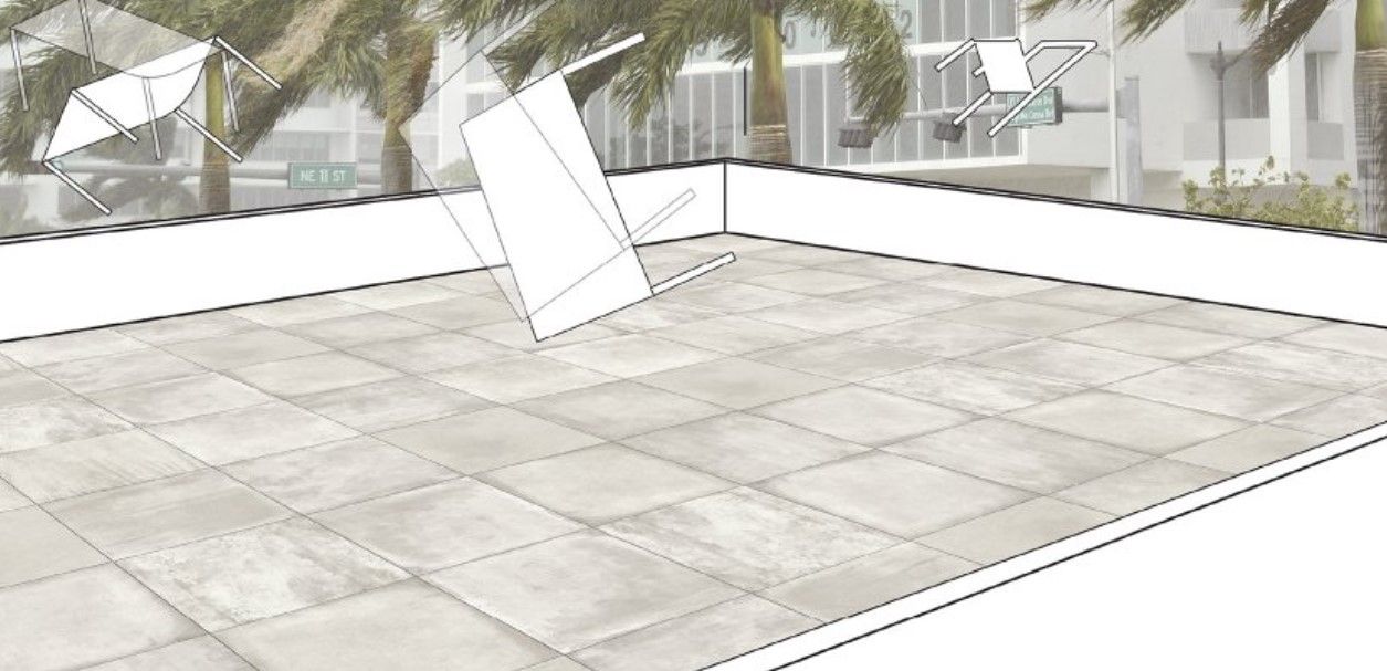 A wind-resistant terrace featuring large, square gray stone-effect tiles. The image includes outlines of furniture being affected by strong winds, demonstrating the durability of the tile installation.